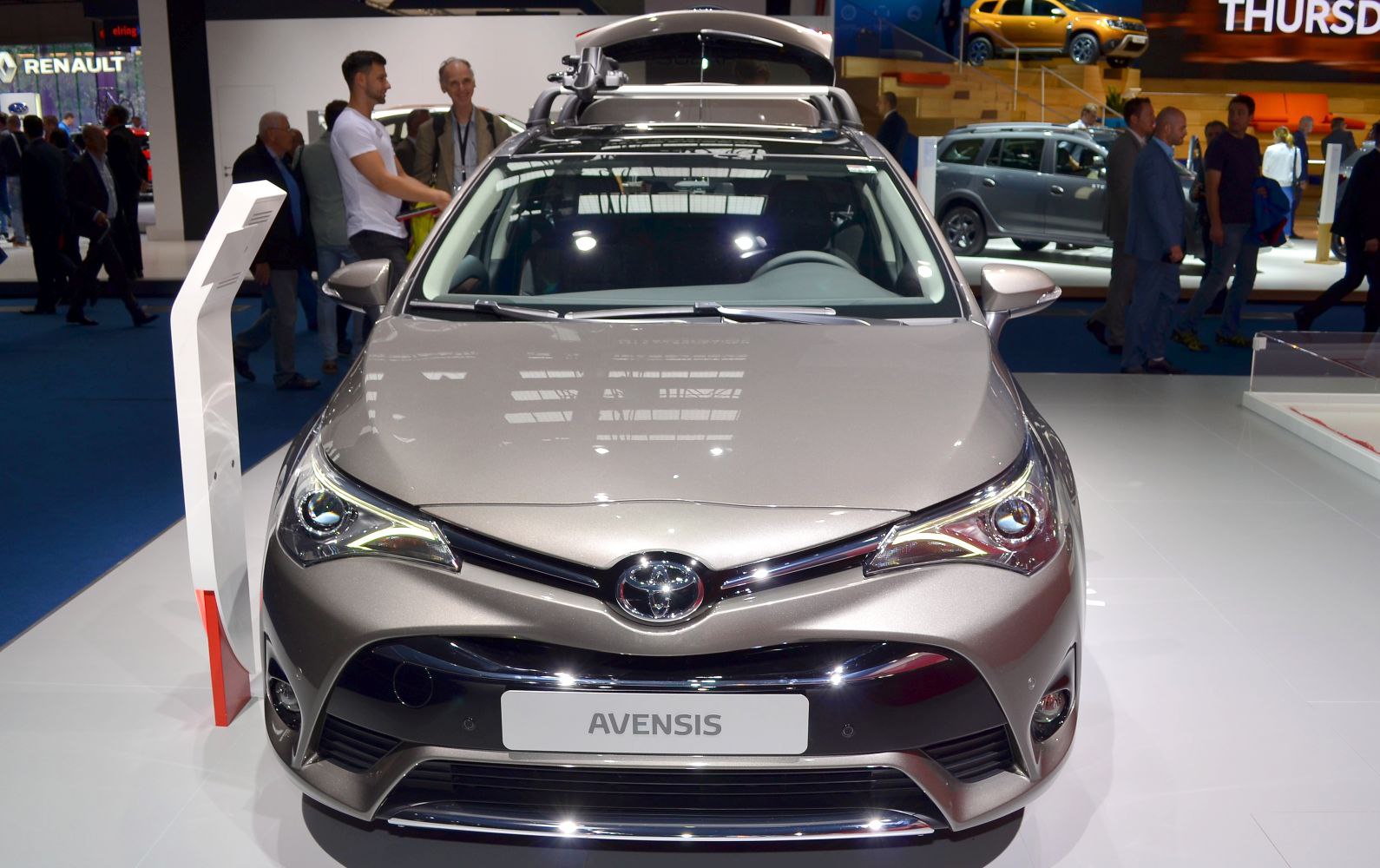 Front view of car with aggressive headlights and roof rack