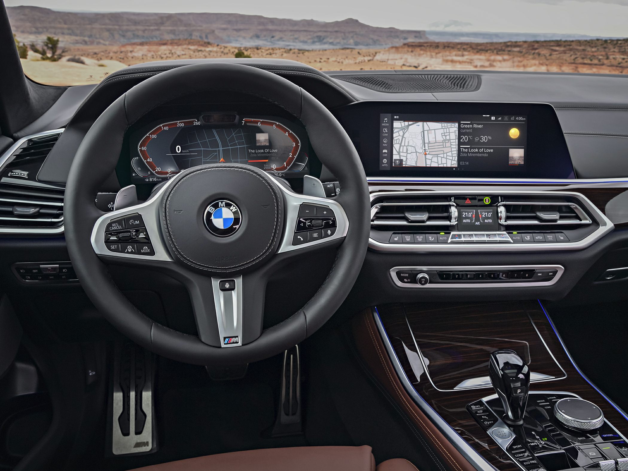 Digital instrument cluster and central infotainment display inside luxury SUV interior