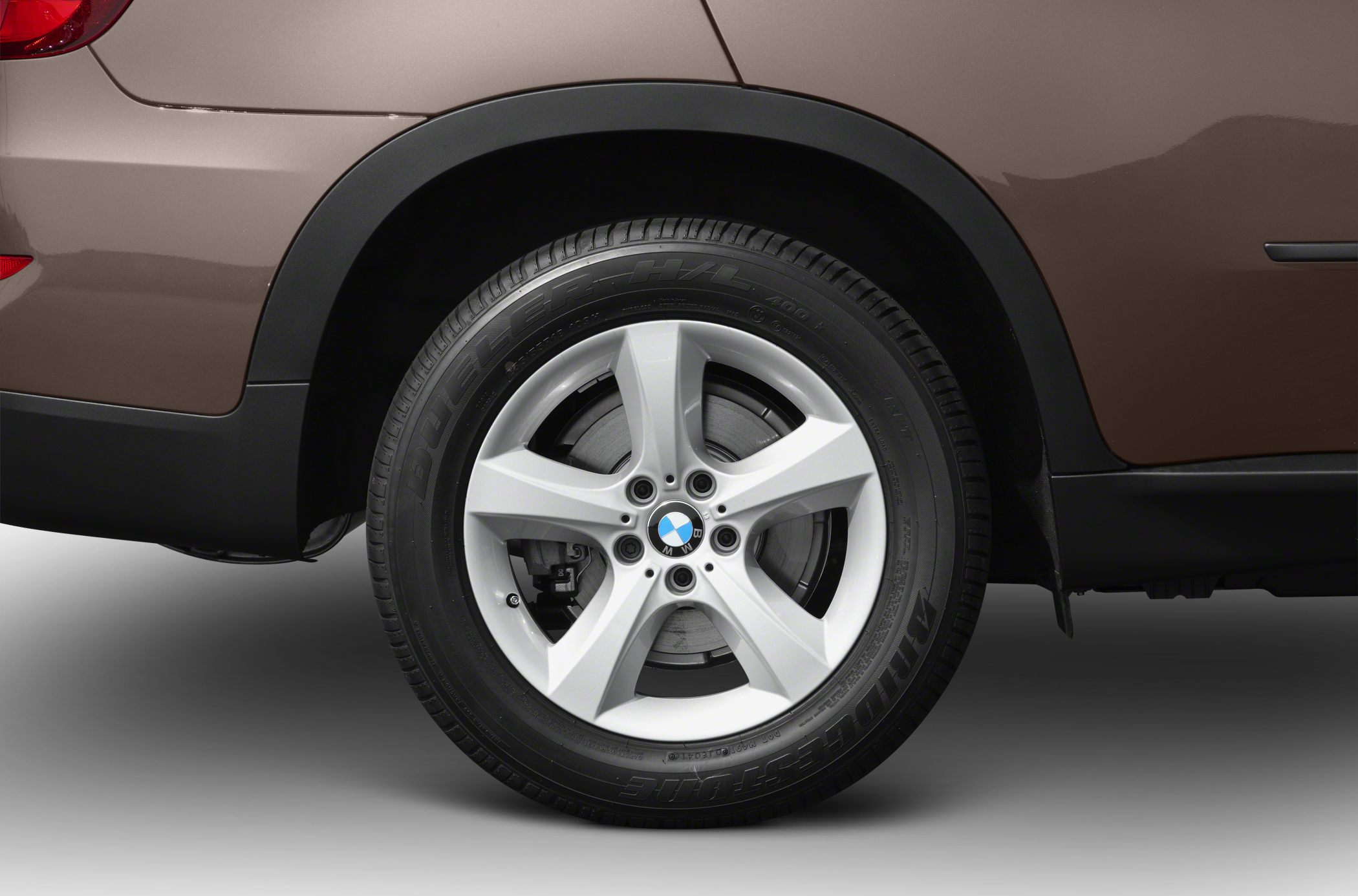Close-up of alloy wheel and fender section with Bridgestone tire
