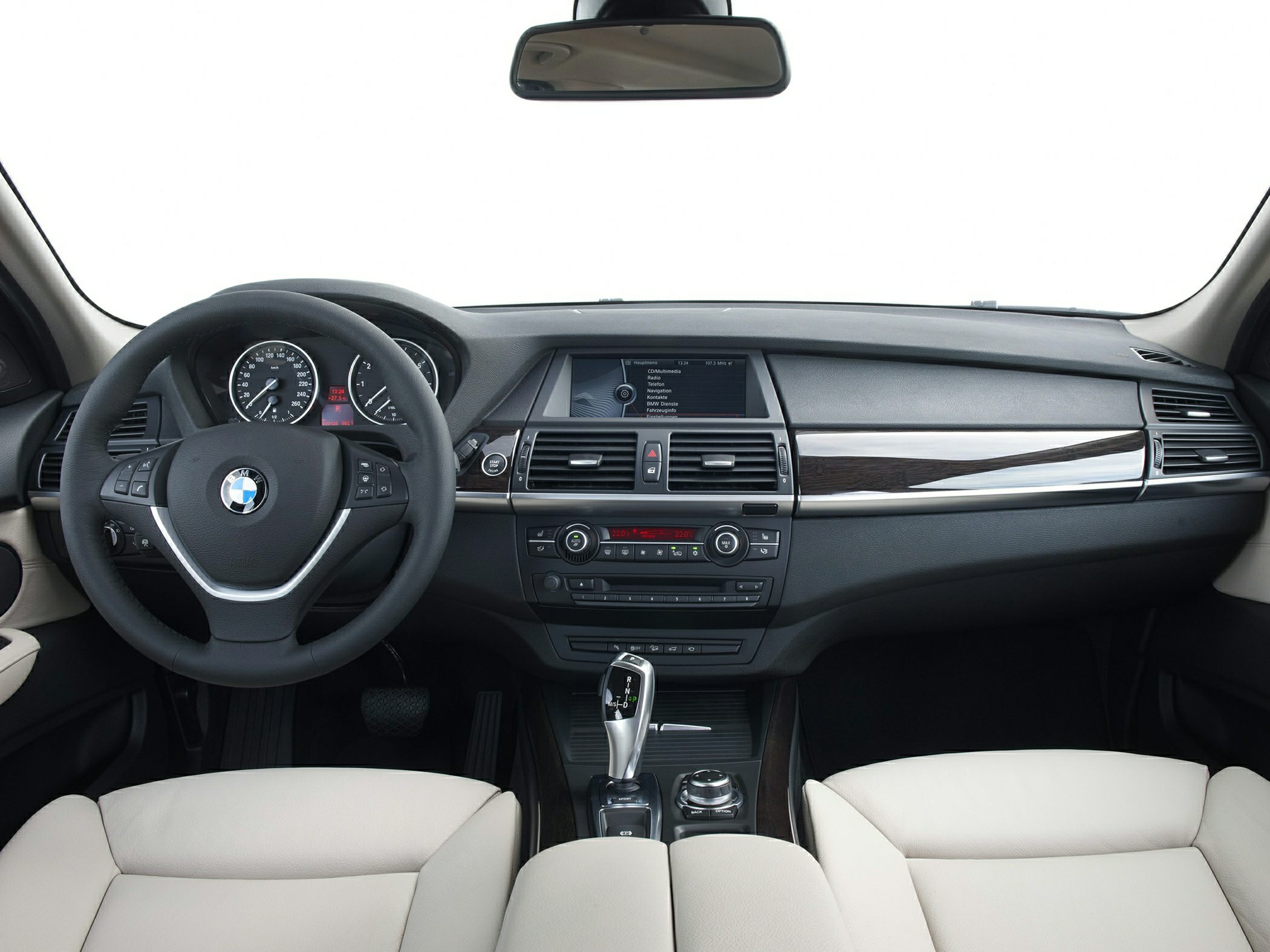 Dashboard and steering wheel with multimedia and control interface.