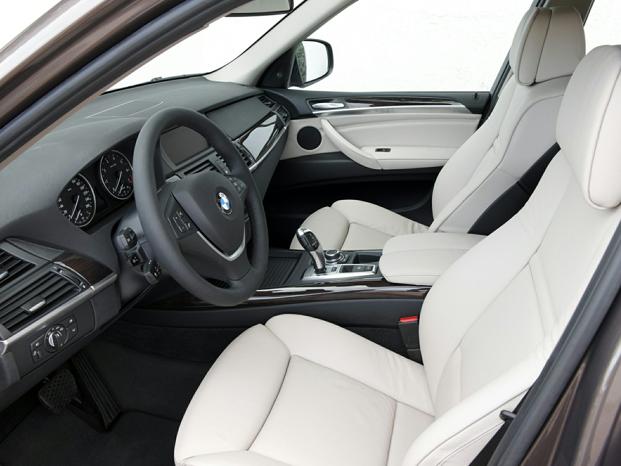 Luxury leather seats and modern dashboard with gear shifter.