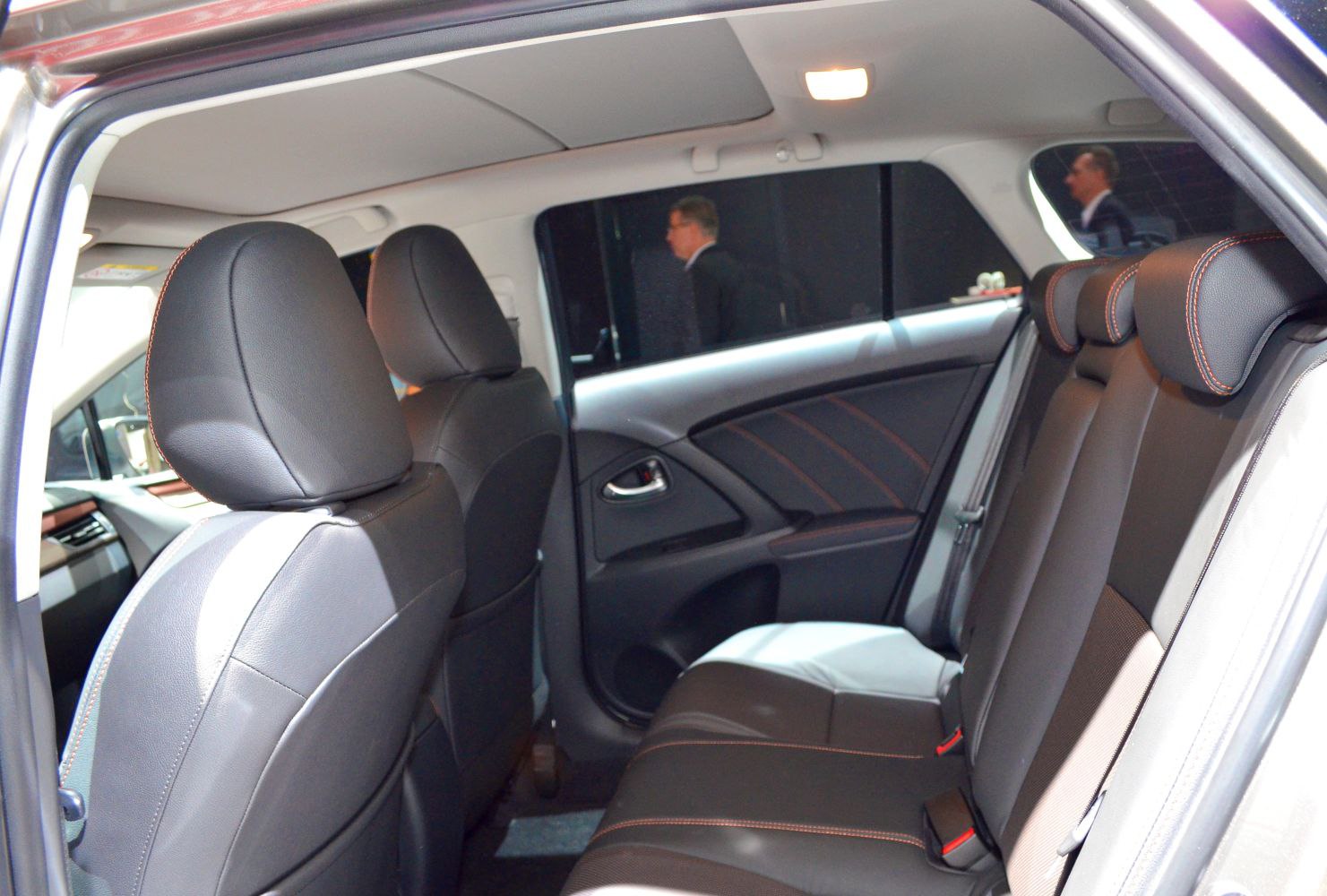 Rear seats with black upholstery and detailed stitching