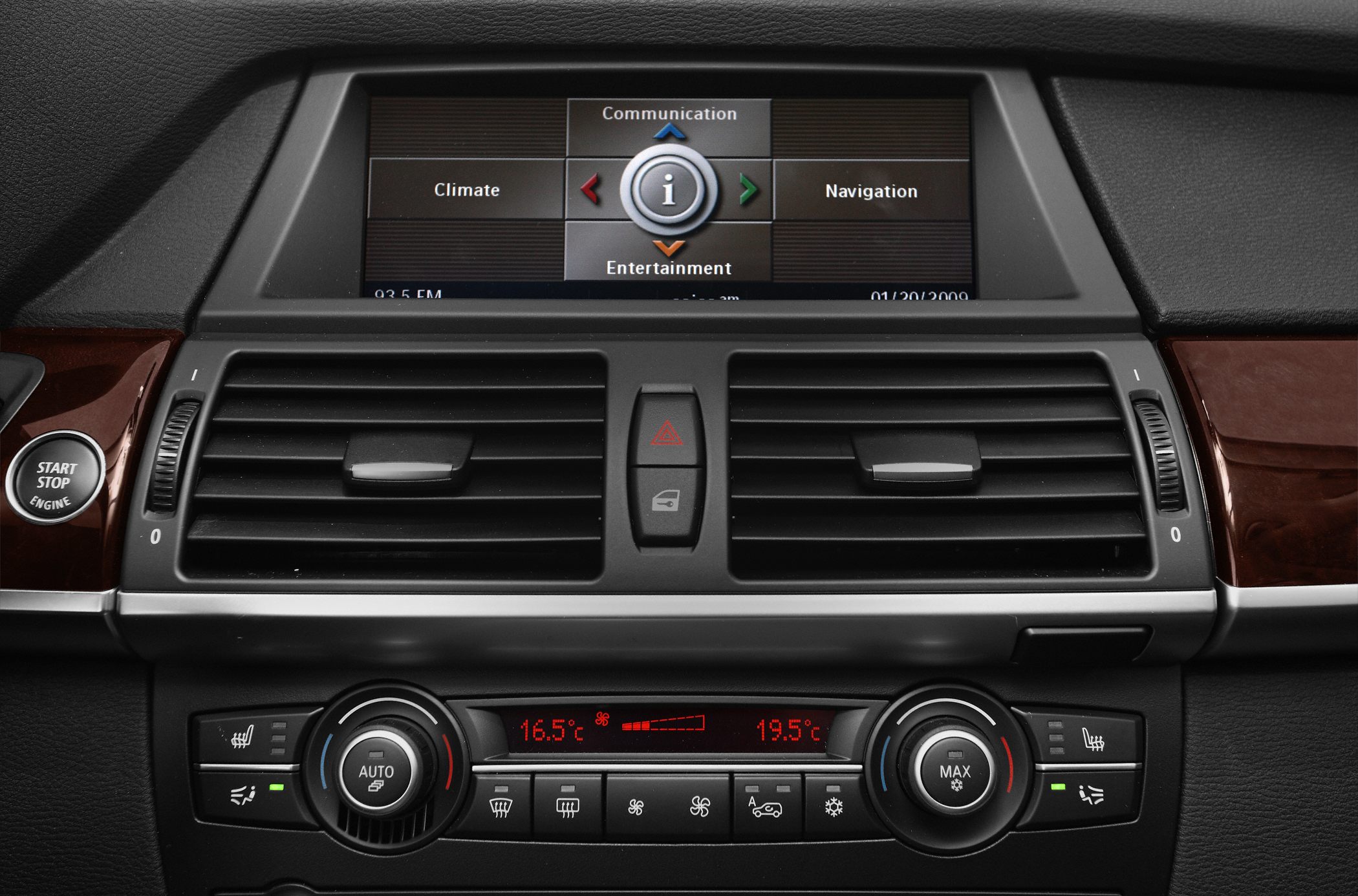 Dual-zone climate control, center air vents, navigation screen, start-stop button