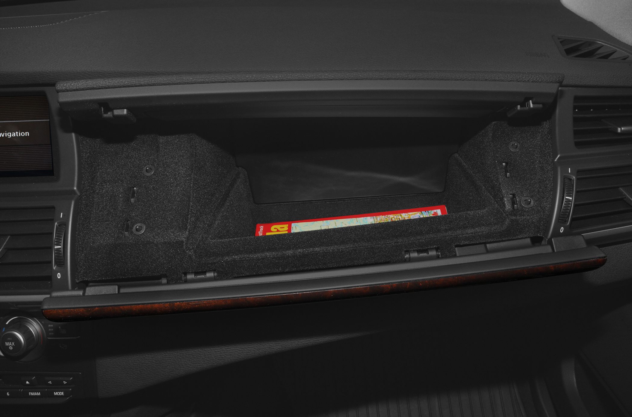 Open glove compartment storage inside vehicle dashboard