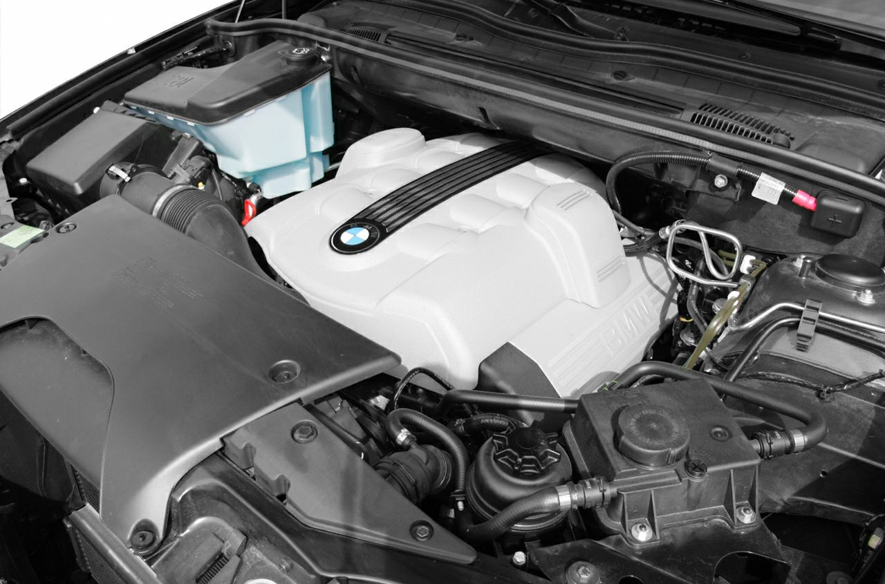 Engine bay with distinct BMW engine cover and surrounding components