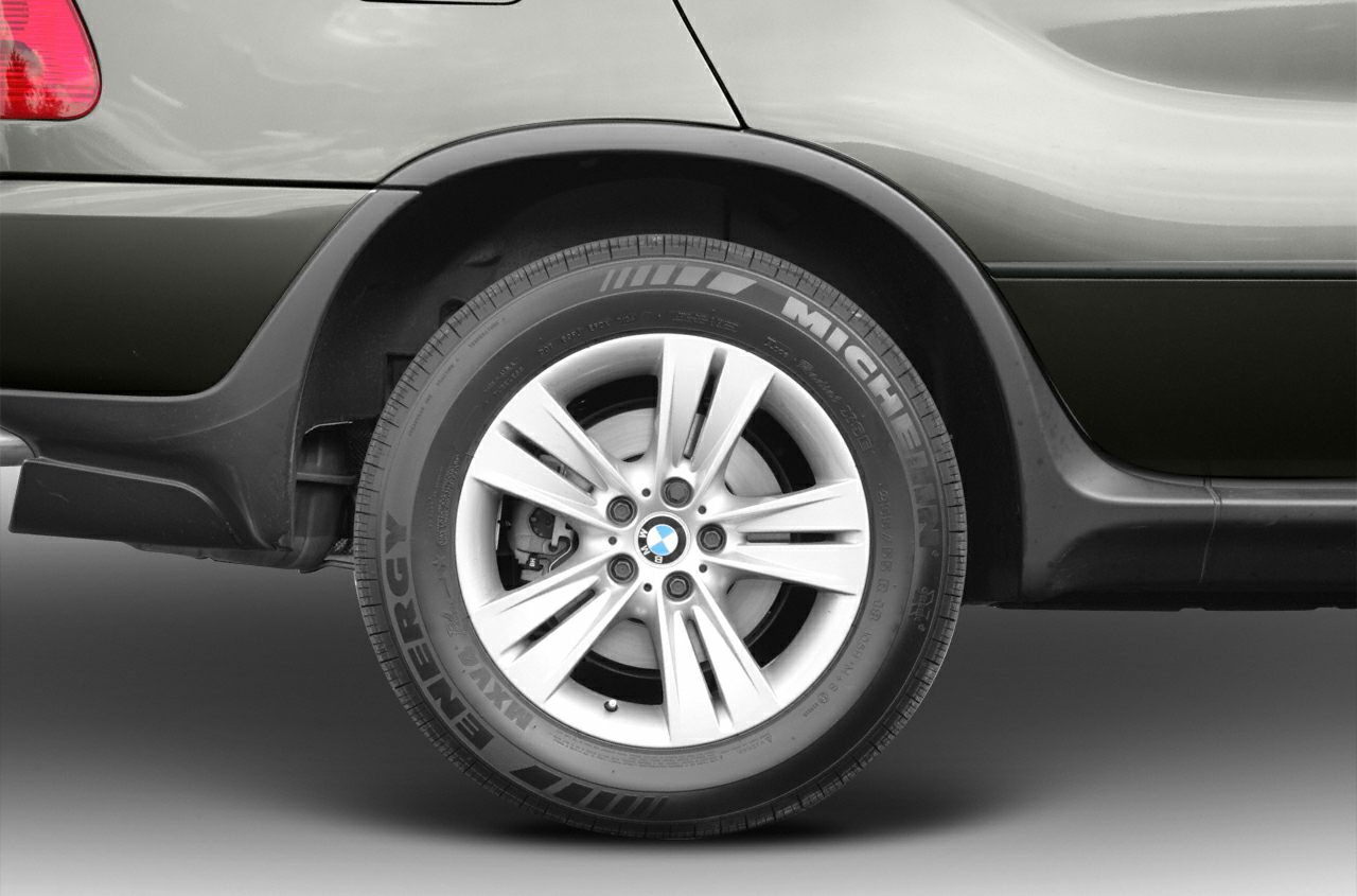 Alloy wheel with Michelin tire on rear side of SUV