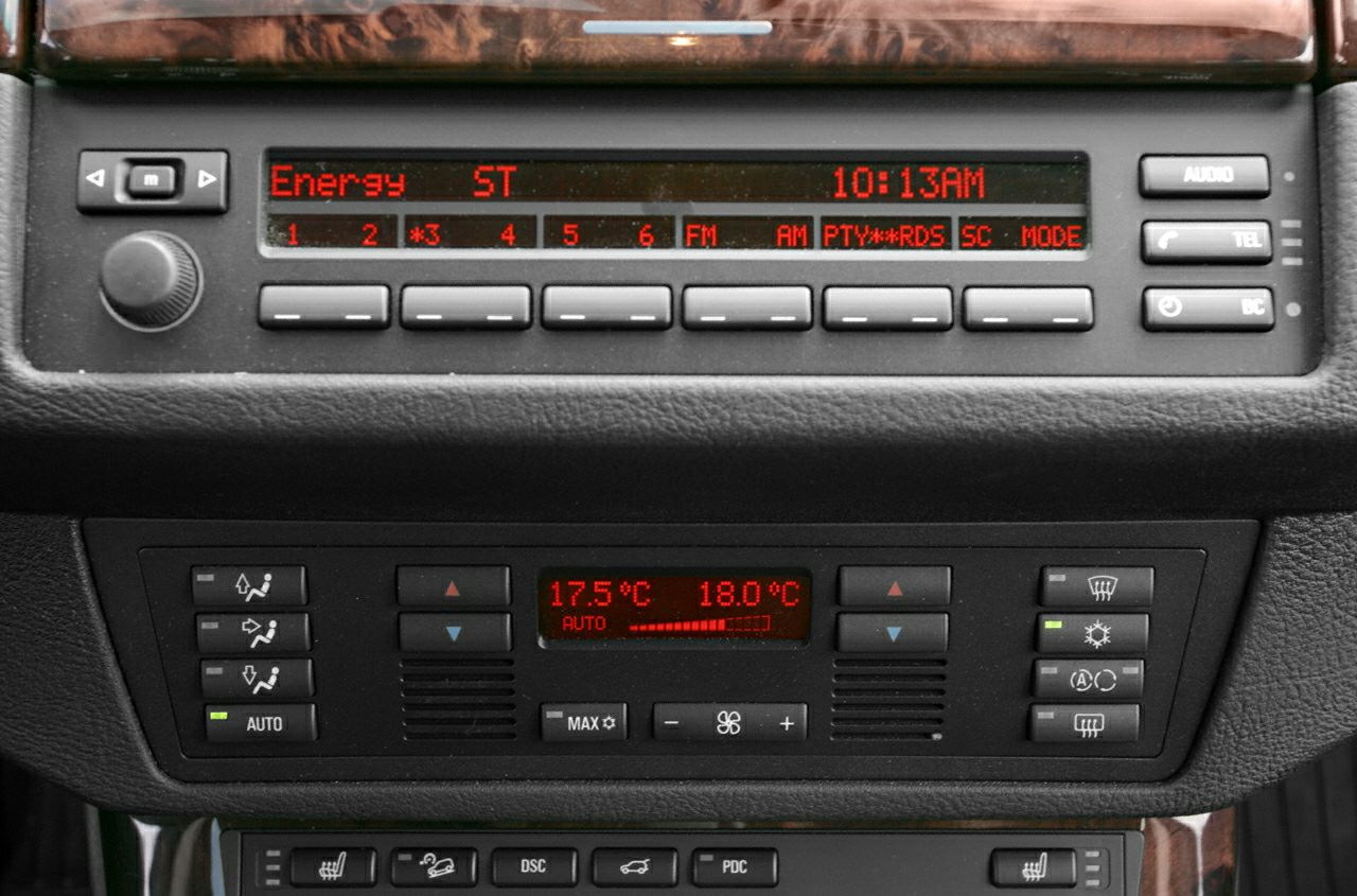 Radio display and dual-zone climate control panel with button controls