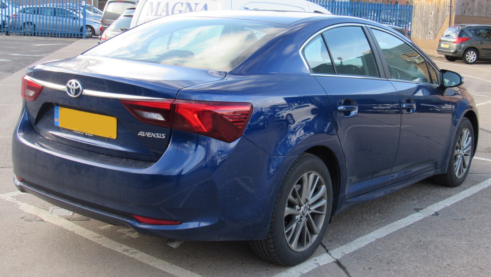 Rear view with LED taillights and alloy wheels of a sedan