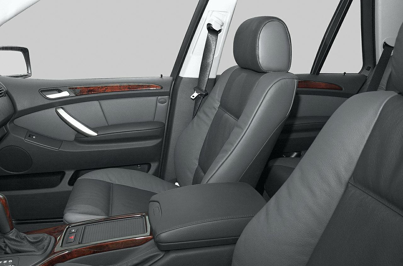 Leather seats and wood trim in car interior