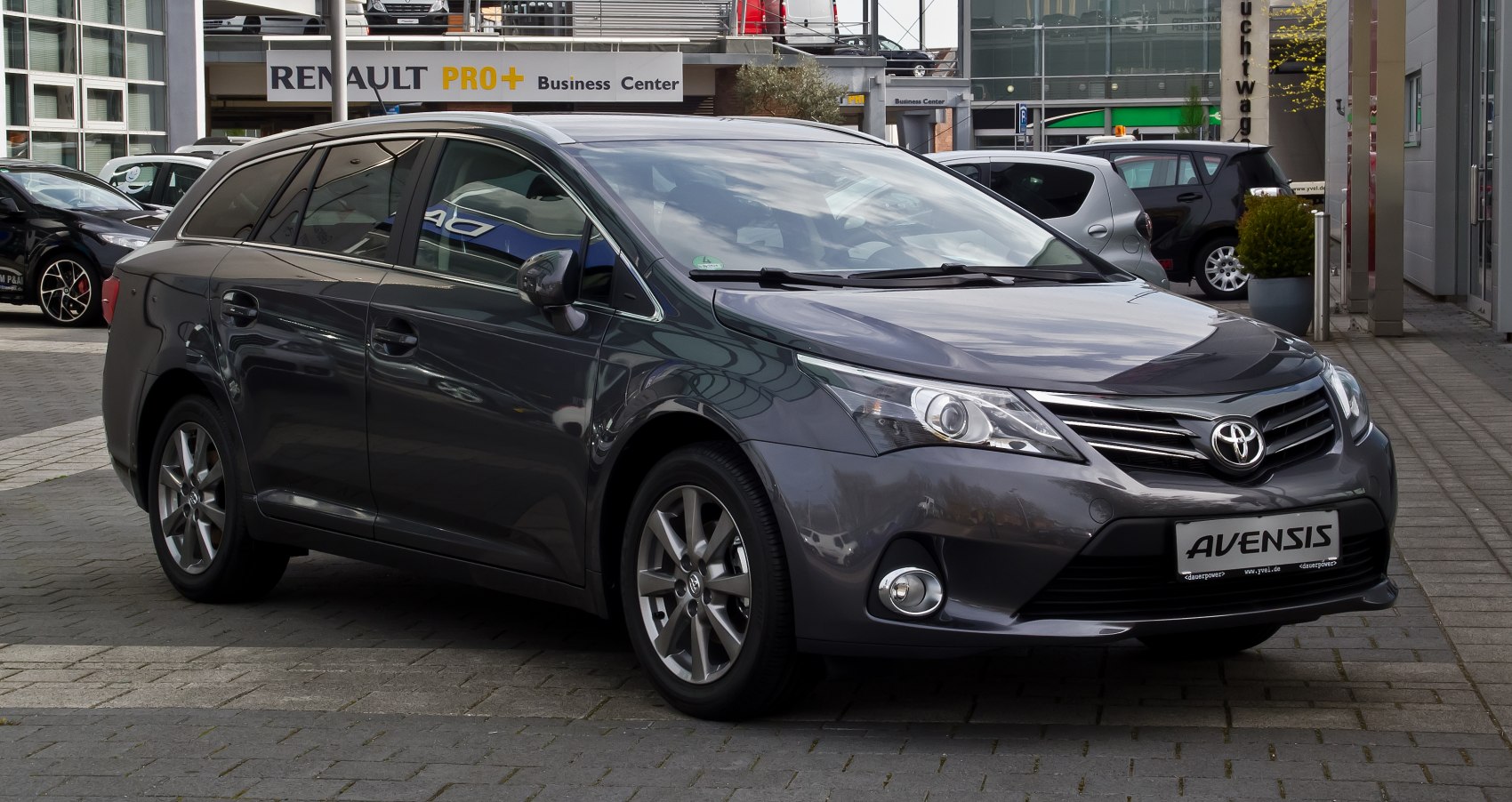 Sleek front exterior with alloy wheels and modern headlights