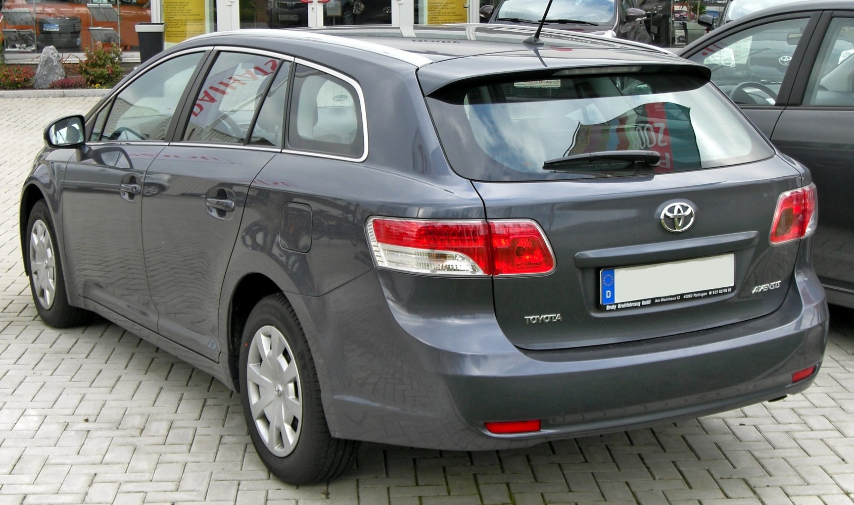 Rear view of a 5-door wagon with taillights and rear window wiper