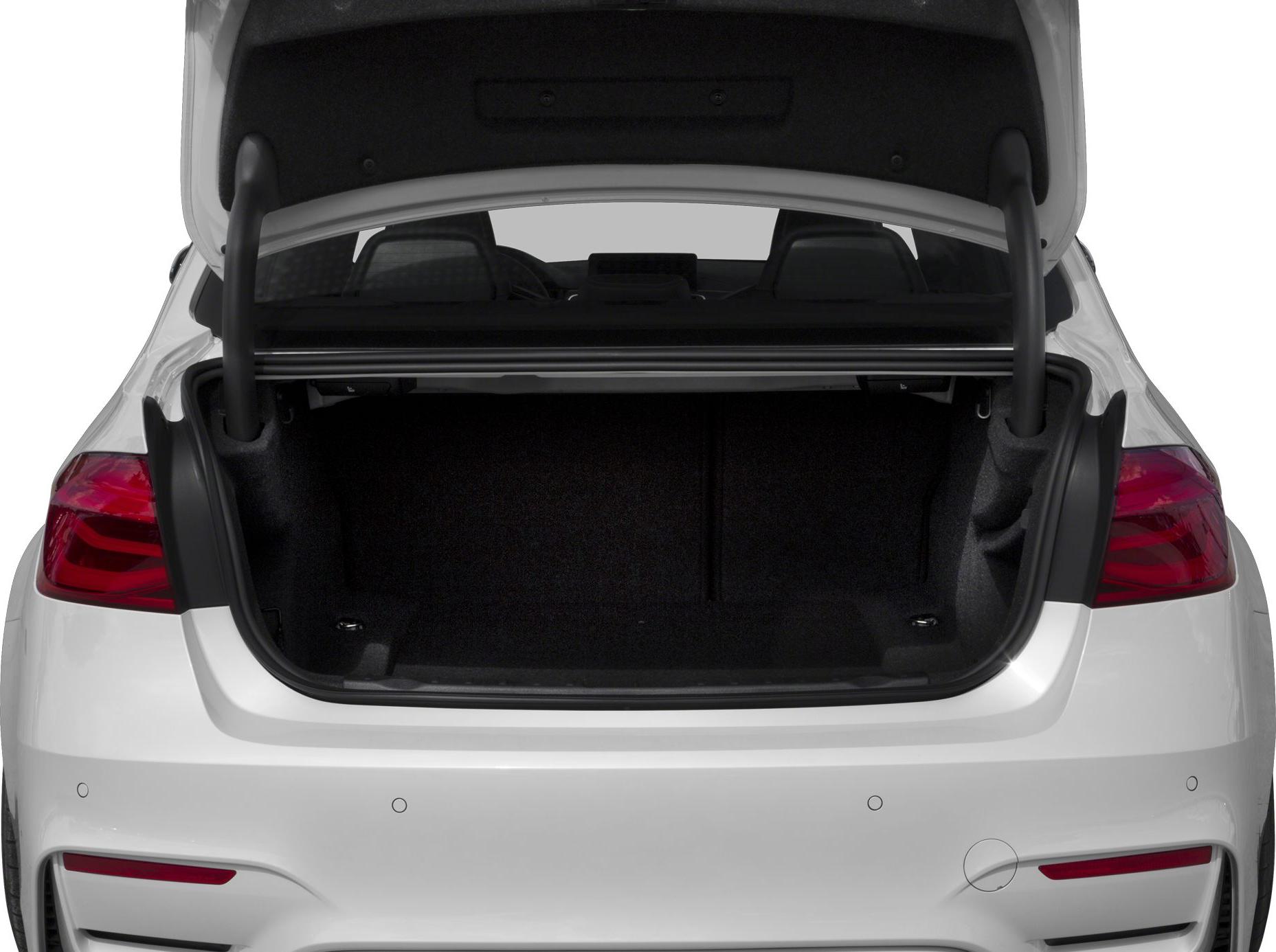 Open trunk rear view of modern sedan showing spacious cargo area and rear design.