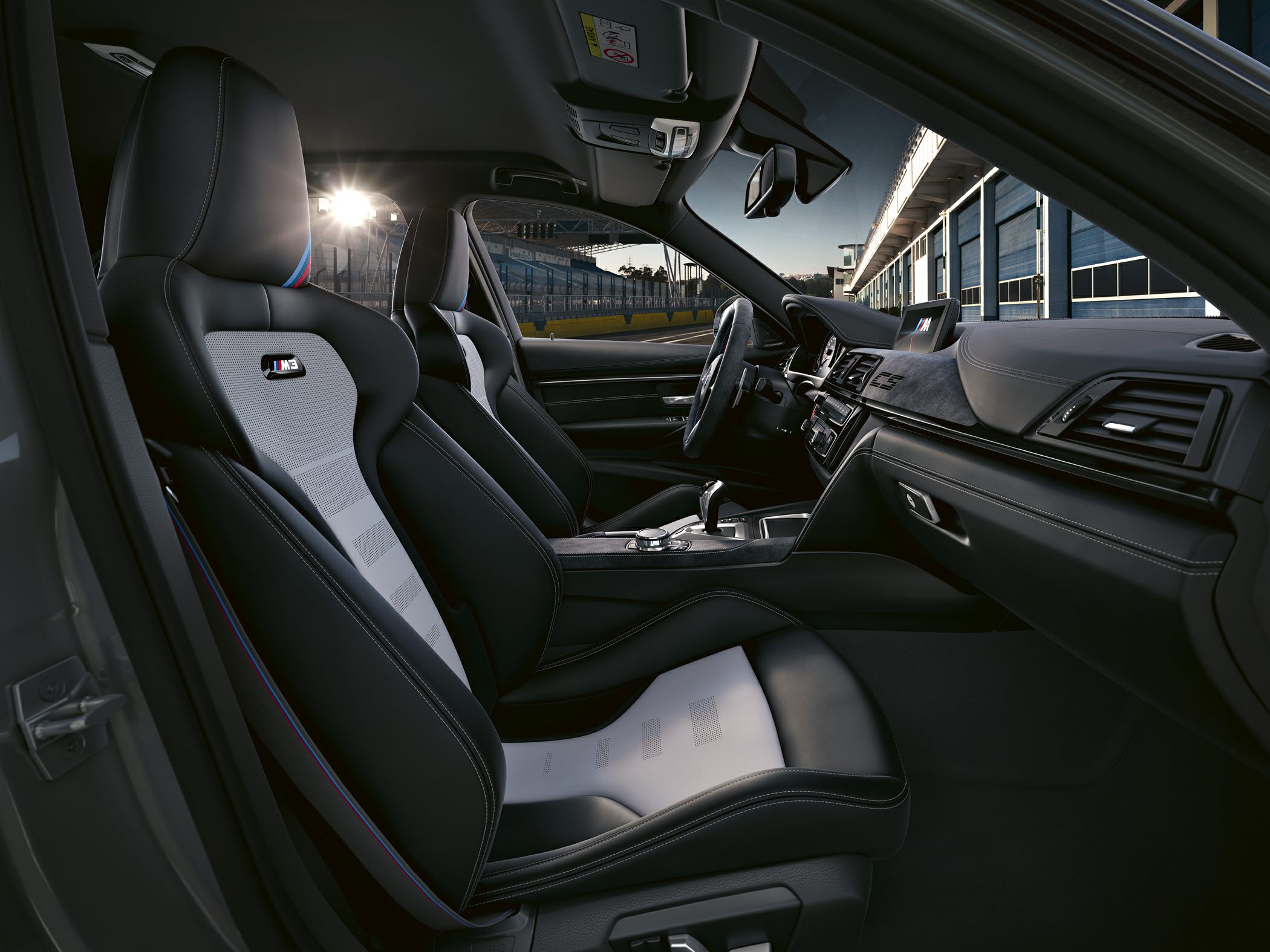 Sport seats with M logo and modern dashboard in car interior