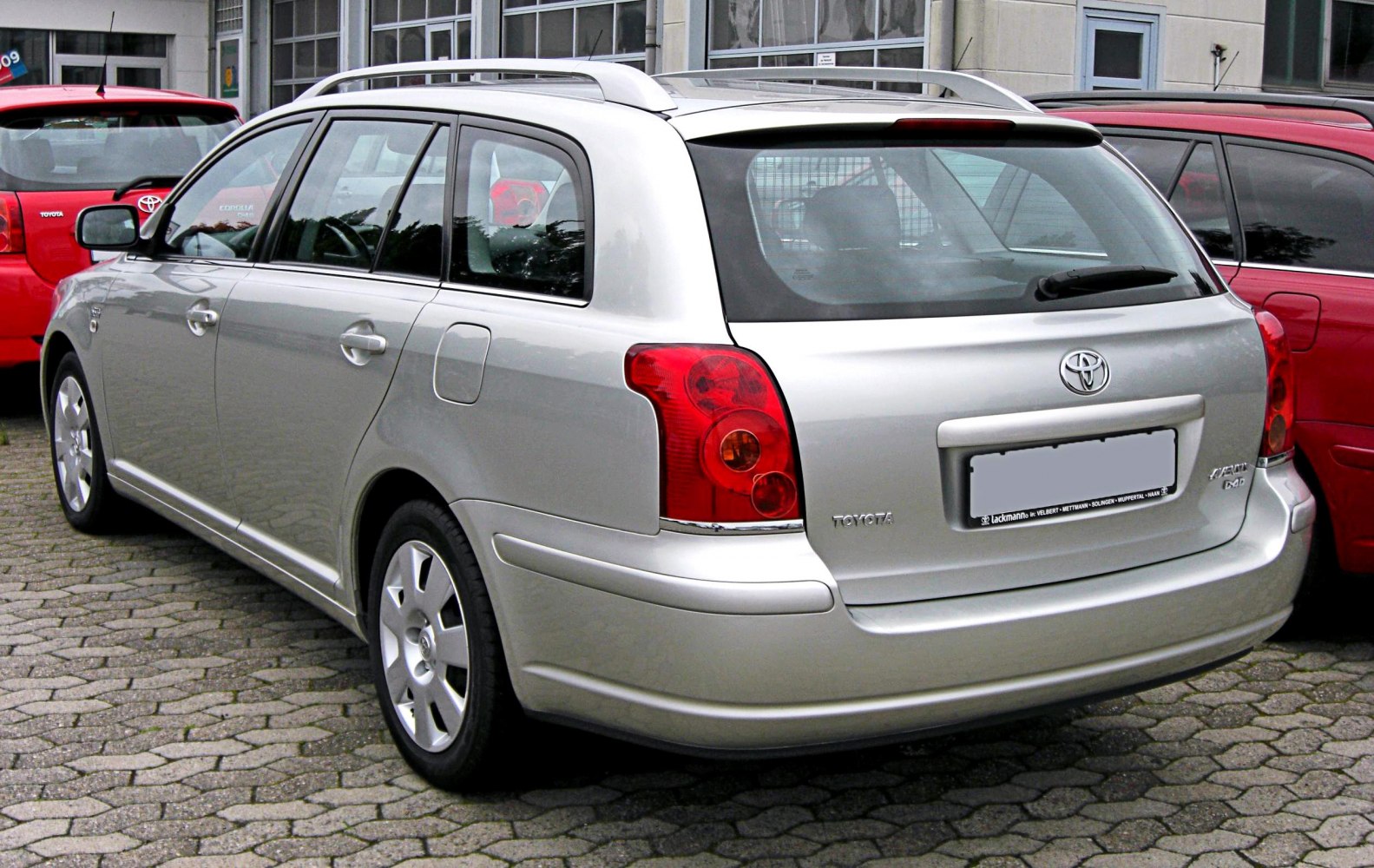 Silver station wagon rear with roof rails and tail lights
