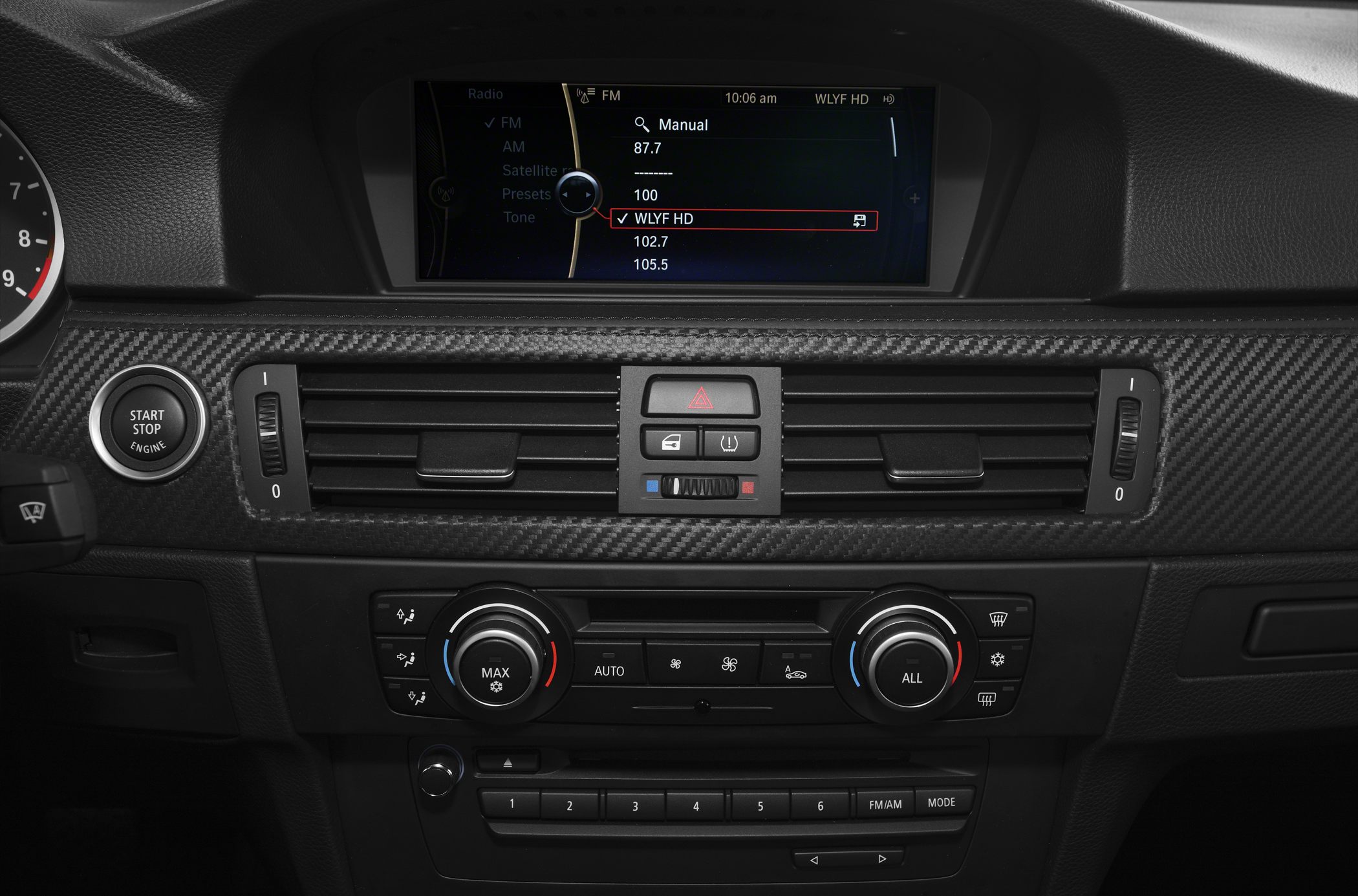 Dual-zone climate control and infotainment screen in carbon fiber dashboard