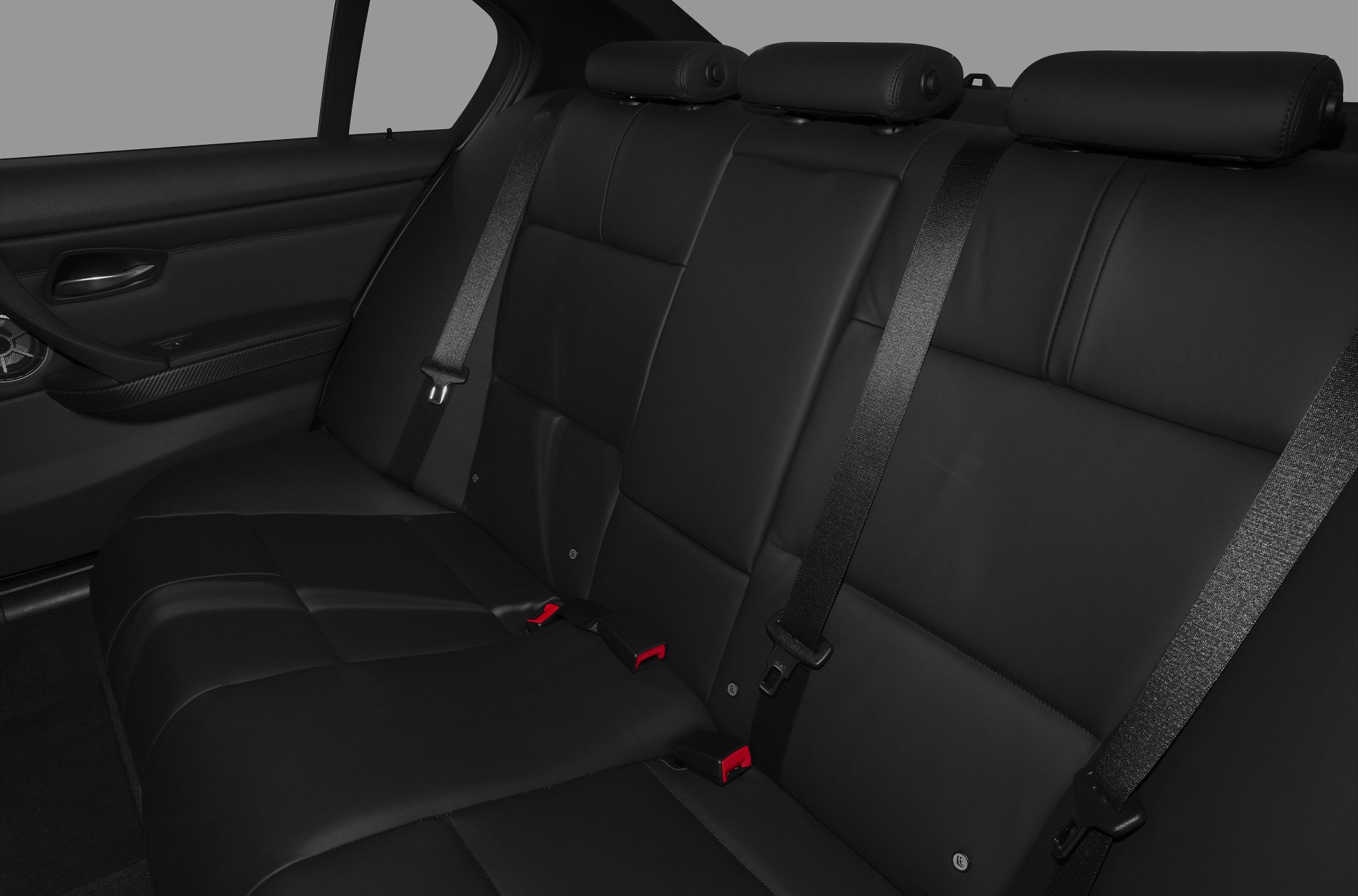 Black leather rear seat interior with headrests and seat belts