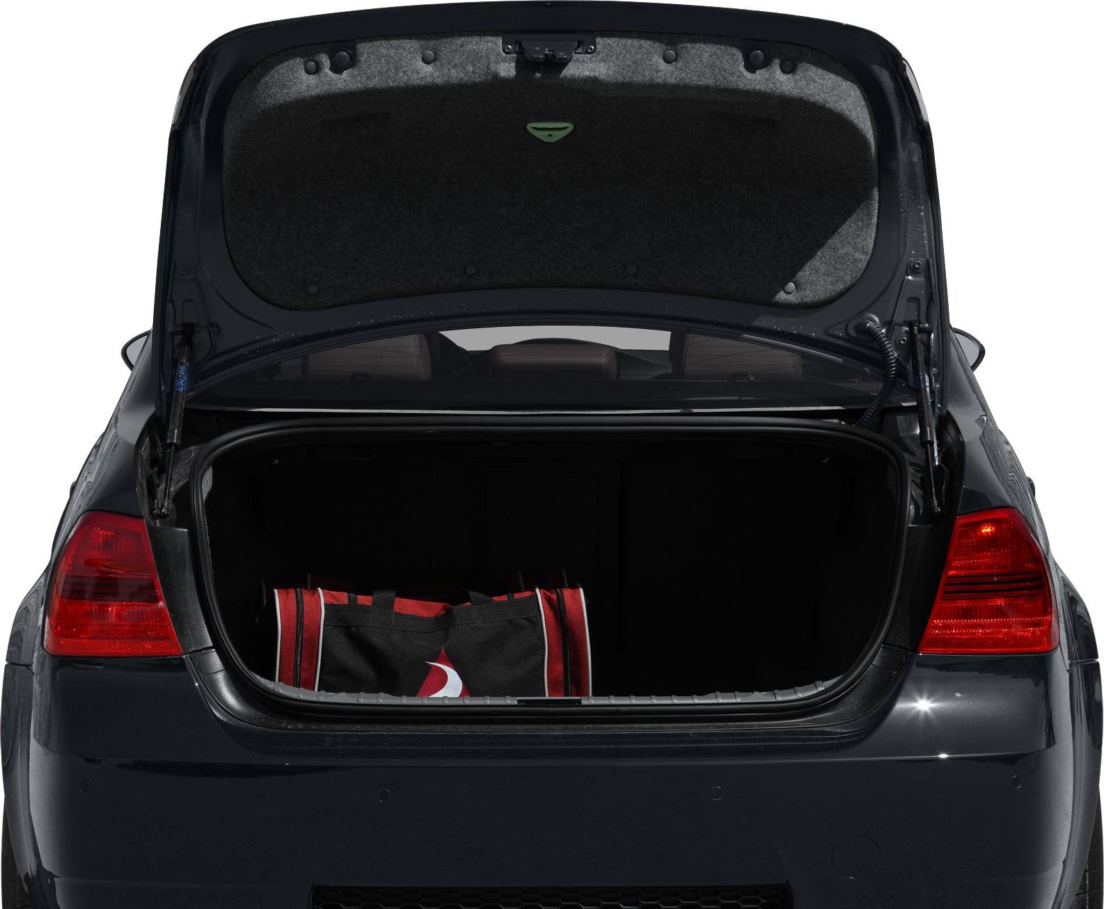 Open trunk with red-black luggage and taillights on rear side