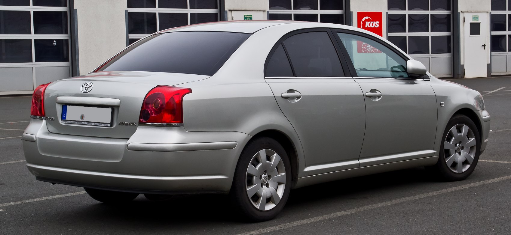 Silver mid-size sedan rear and side view with distinctive rear lights