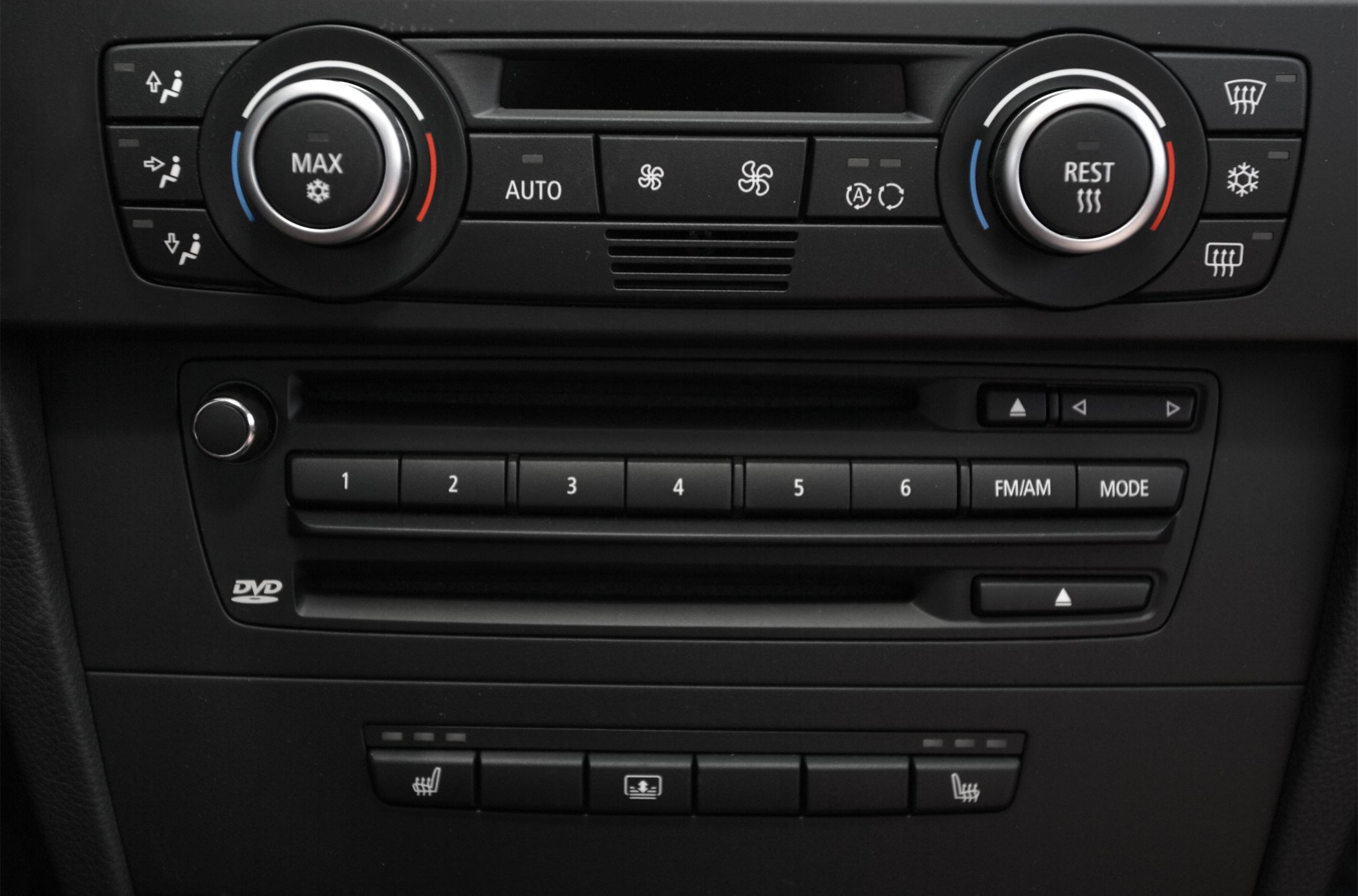 Climate control dials and audio system with DVD player in a car interior