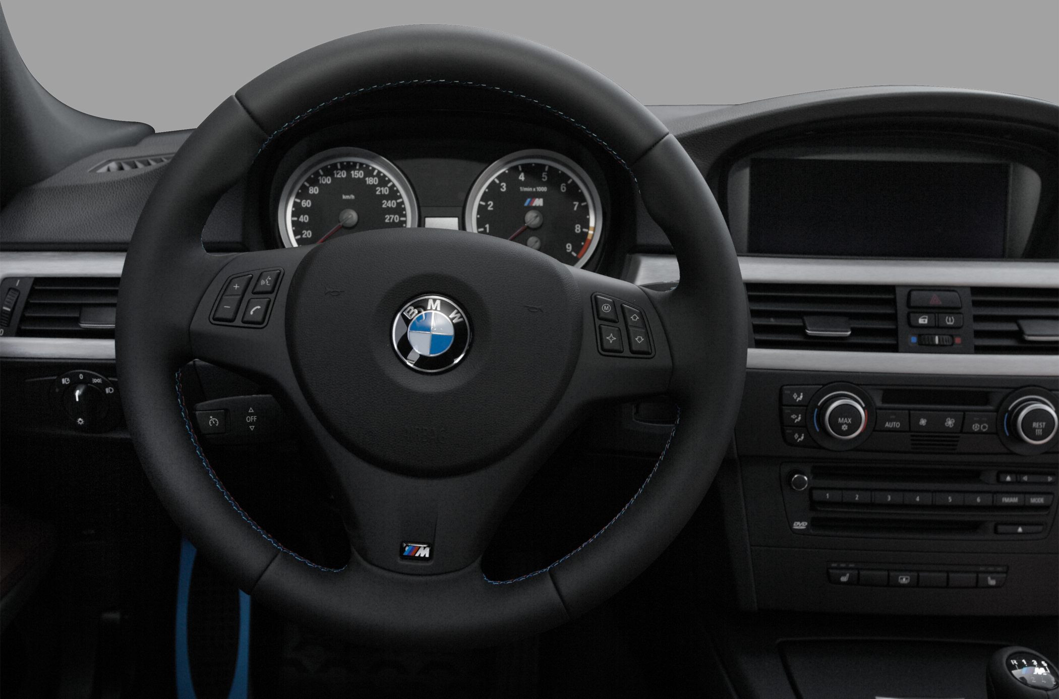 Steering wheel, instrument cluster, and dashboard controls.
