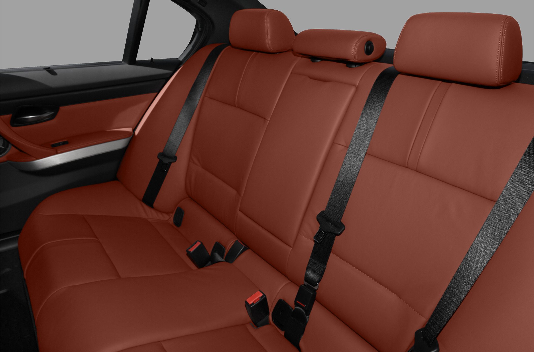 Leather rear seat with seatbelts and headrests in car interior