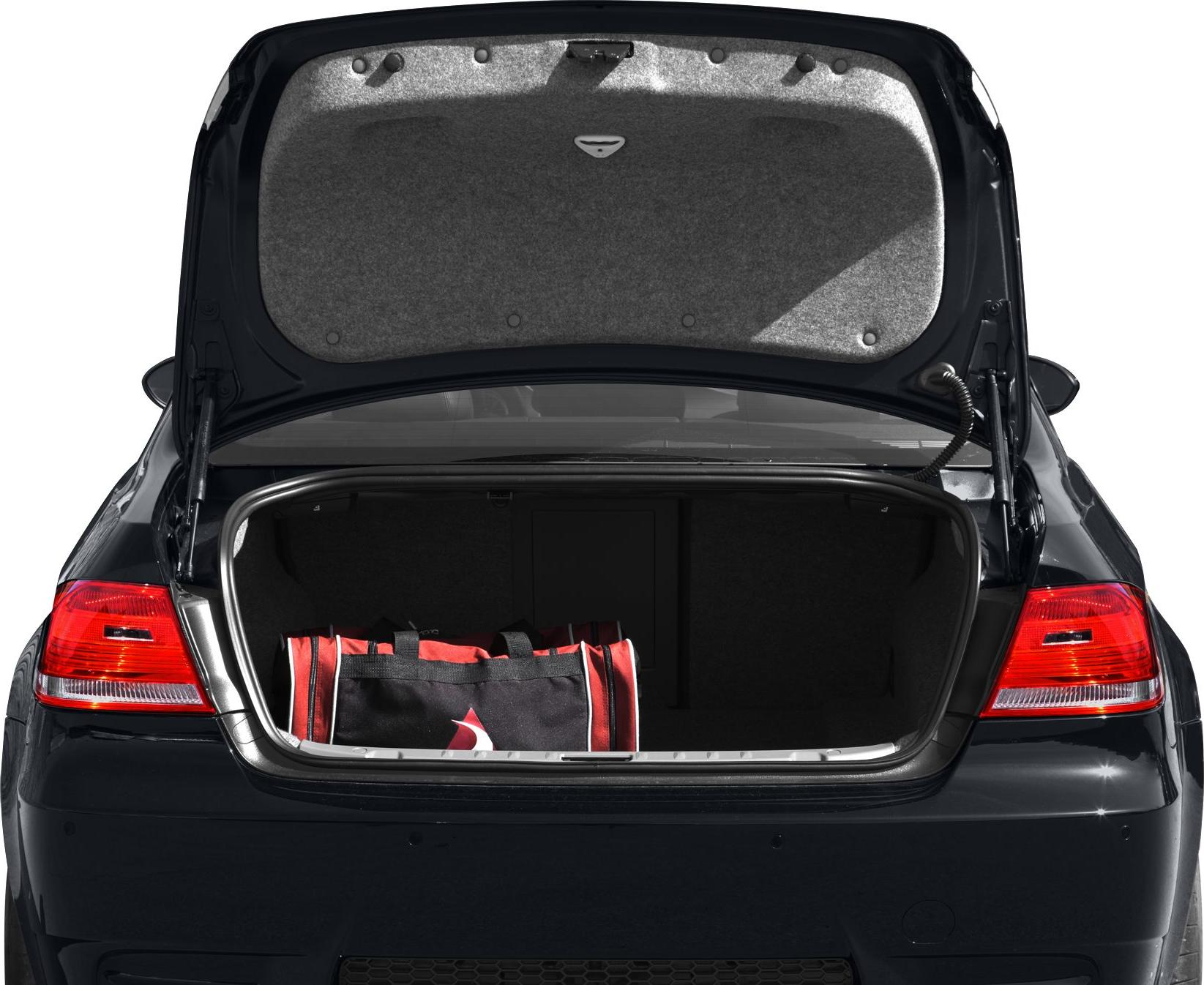 Open trunk with red and black sports bag inside and visible taillights