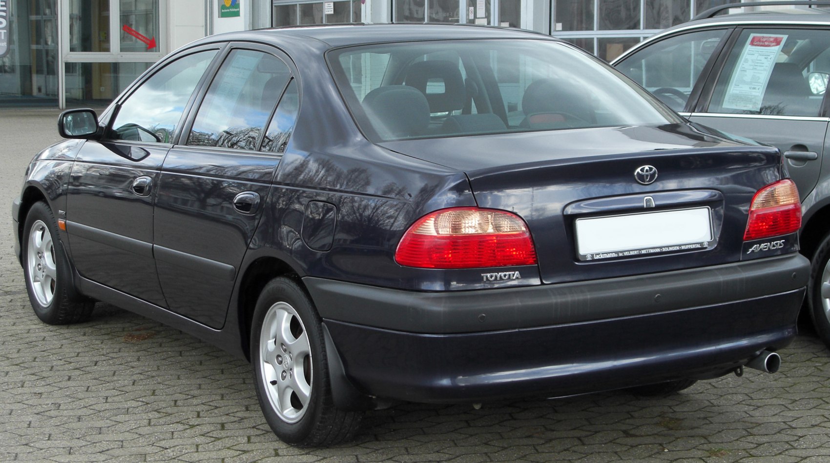 Rear and side view of a mid-size sedan showing taillights and body contours