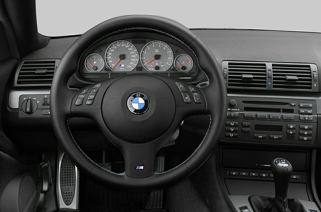 Dashboard, steering wheel, and center console with manual shifter