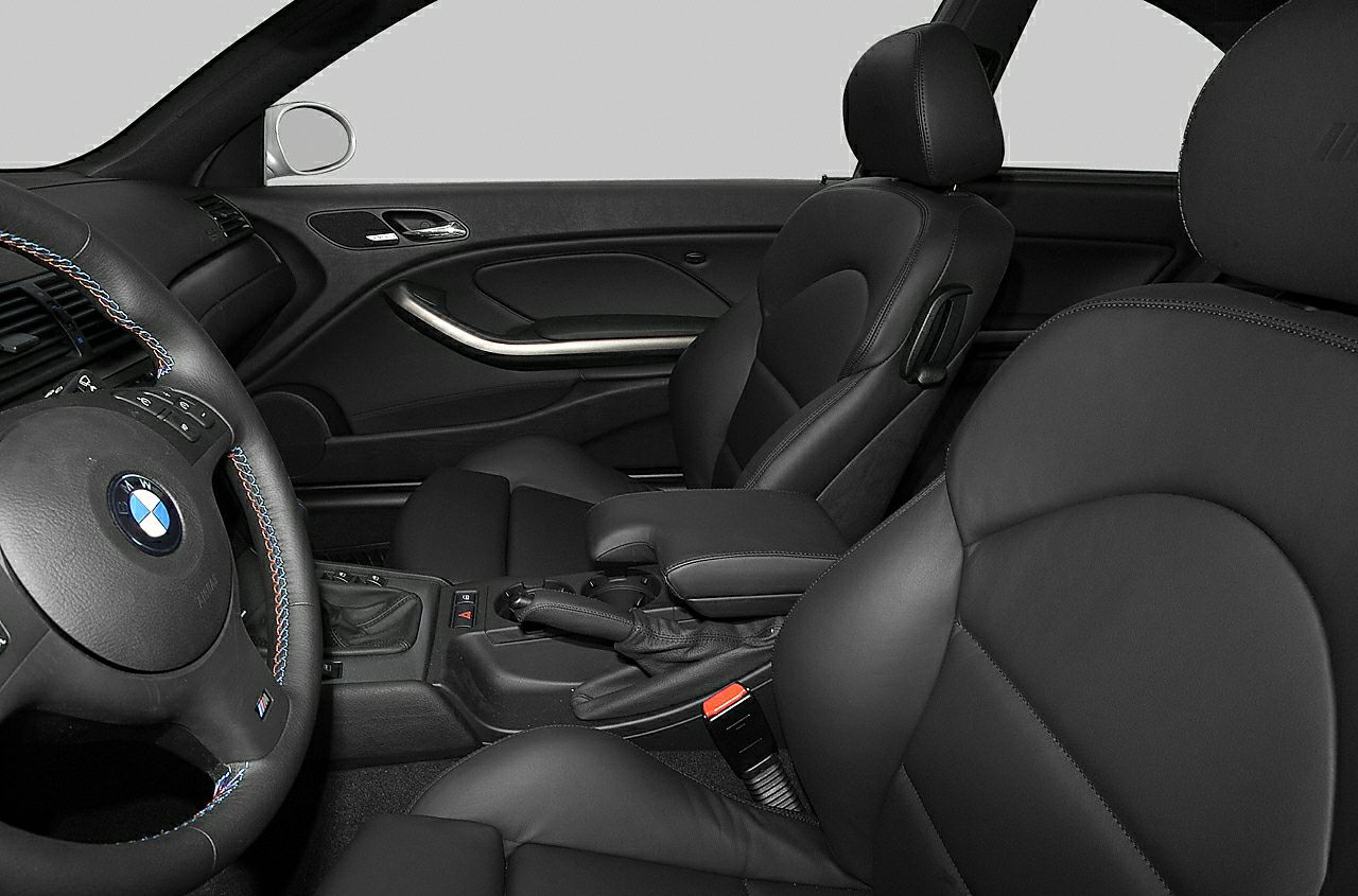 Leather seats and stitched steering wheel in sporty car interior