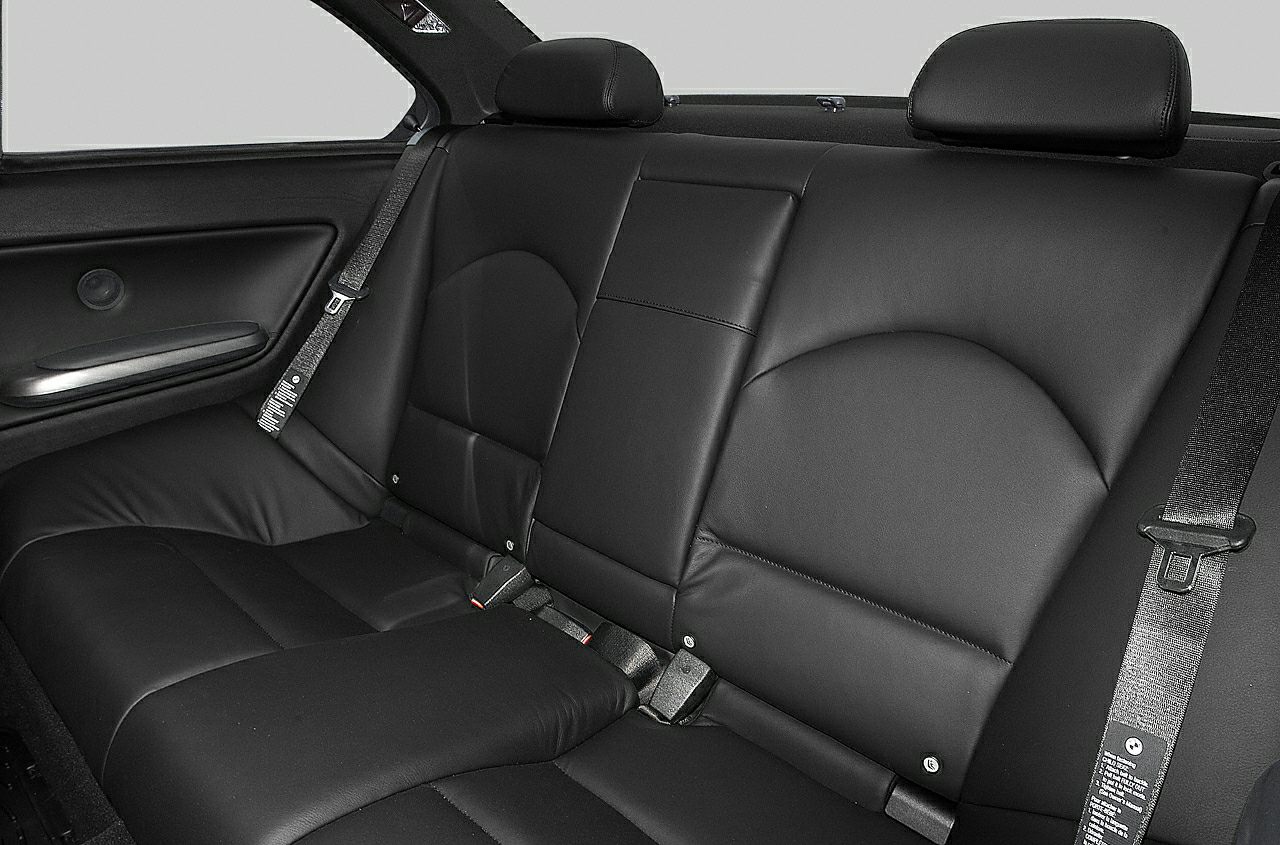 Rear black leather seats with headrests and seat belts