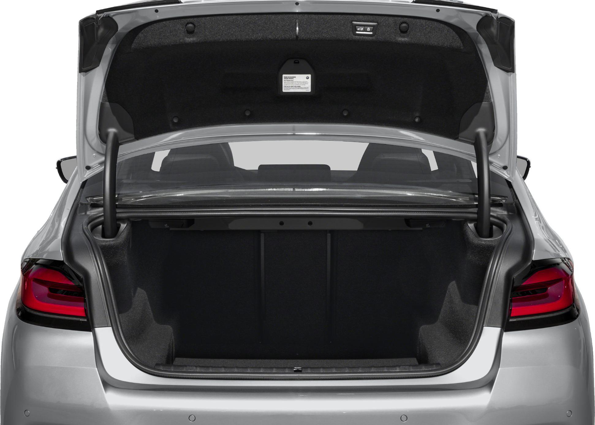 Open rear trunk showing spacious boot interior and taillights