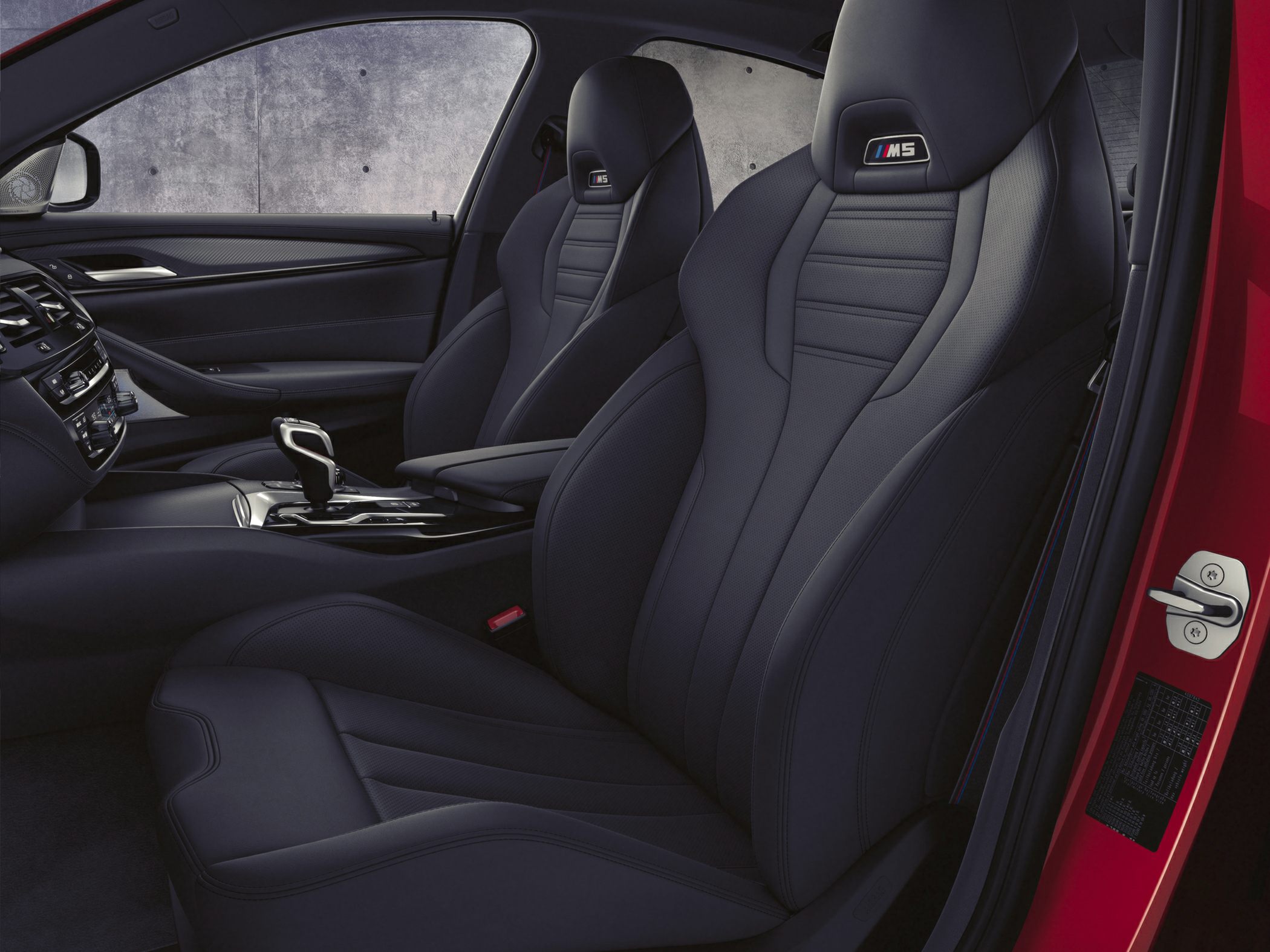Luxury sport seats with M5 emblem in modern car interior