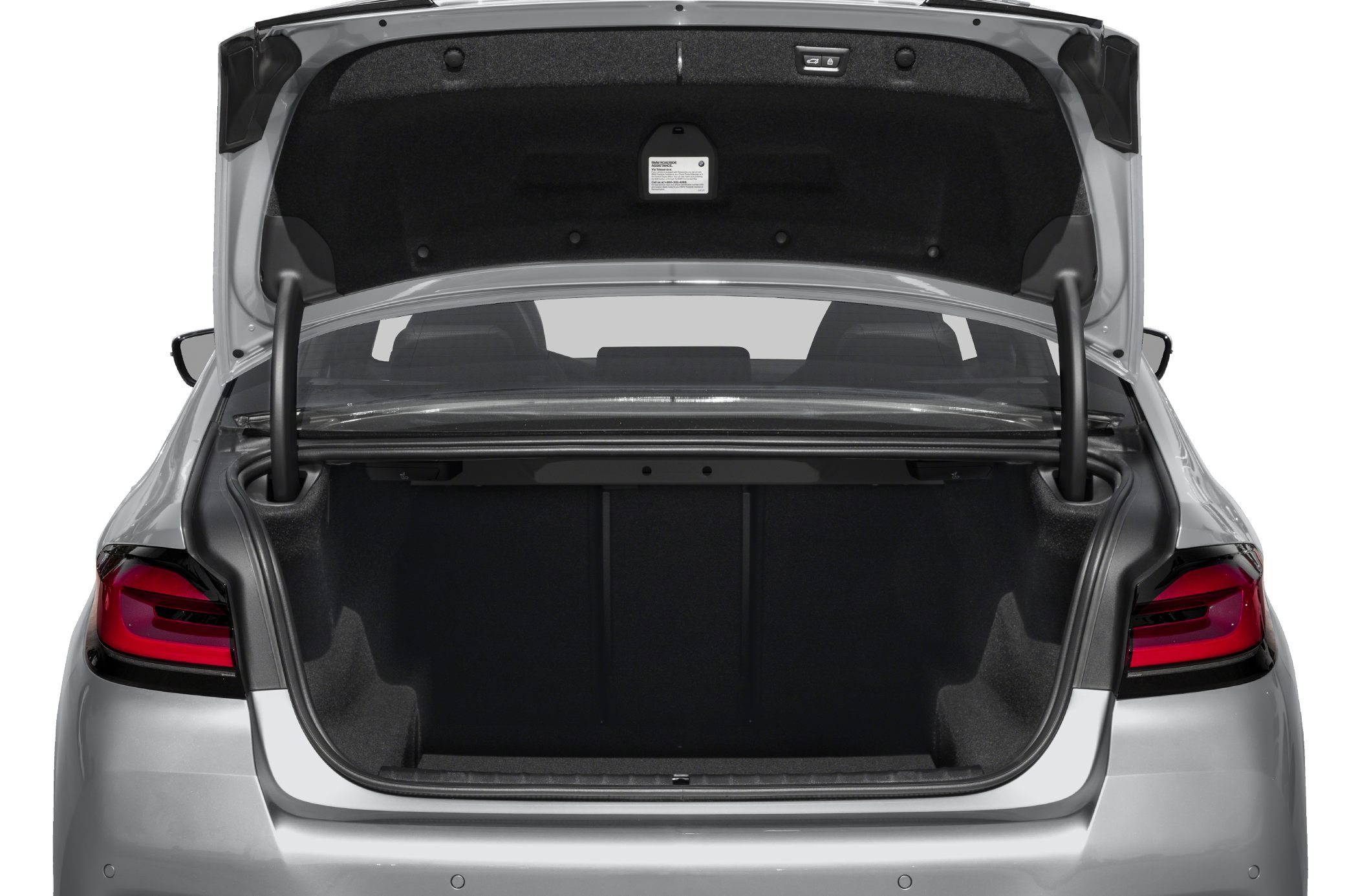 Open trunk with spacious rear cargo area and visible taillights