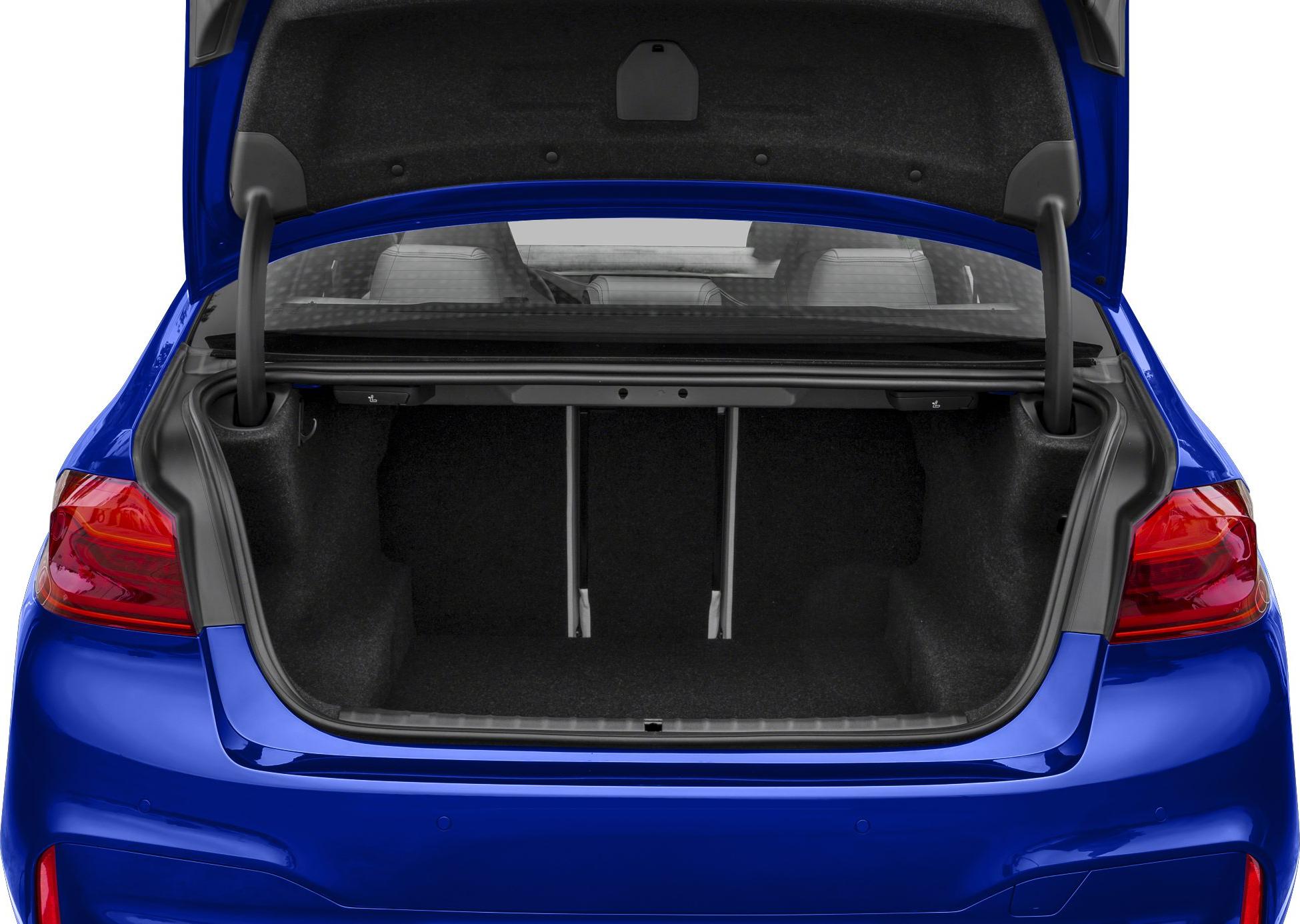 Open trunk rear cargo space with clean black lining and visible seat backs