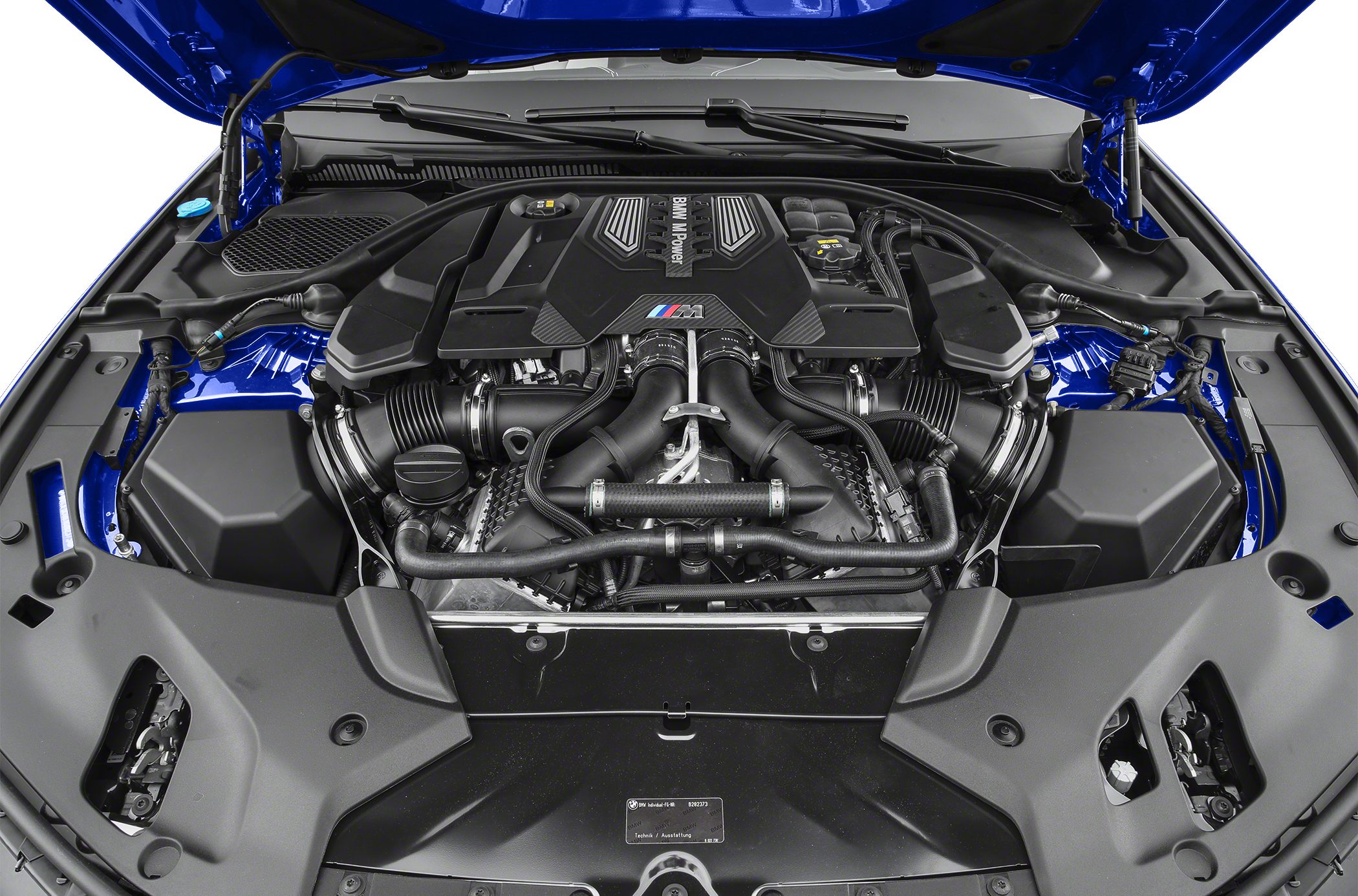 High-performance V8 engine with intricate turbo piping and engine cover