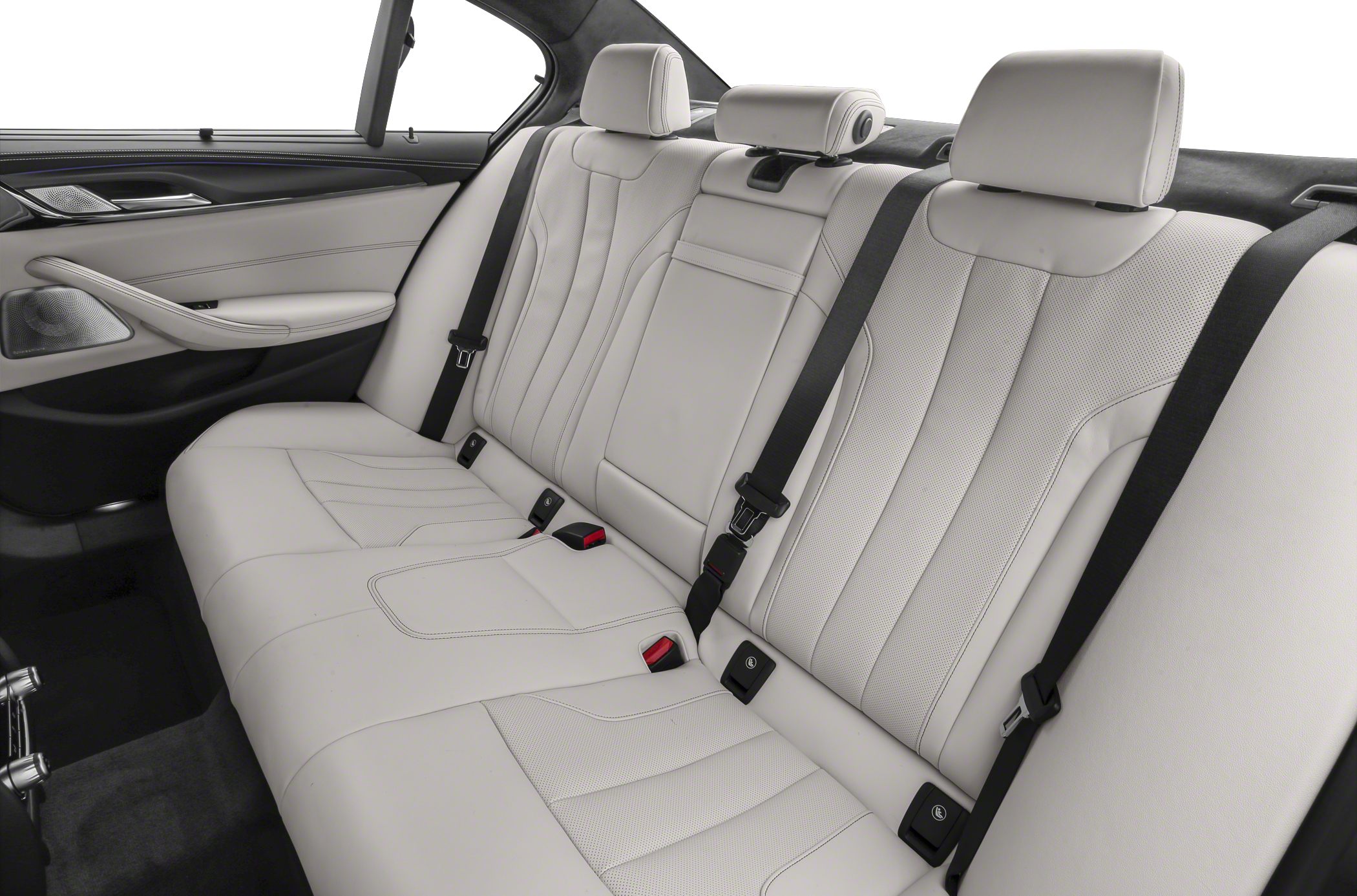 Rear white leather interior seats with seat belts and door panel.