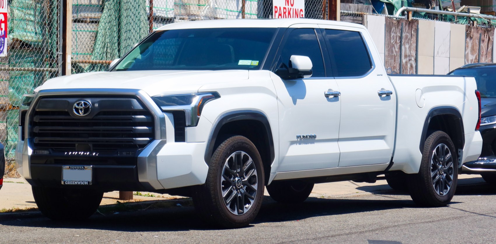 Pickup truck with aggressive front grille and crew cab design