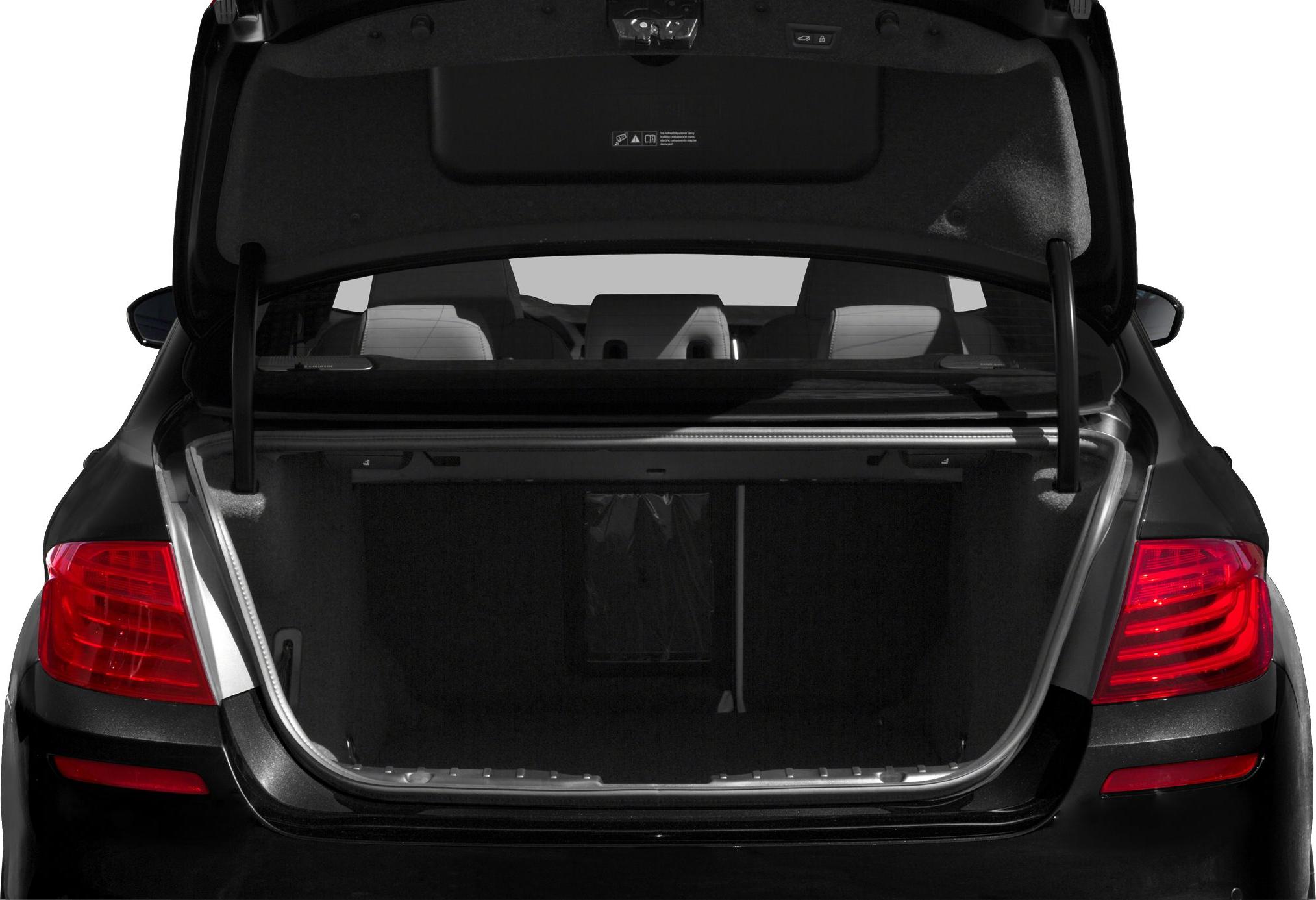 Open rear trunk interior with visible rear seats and taillights