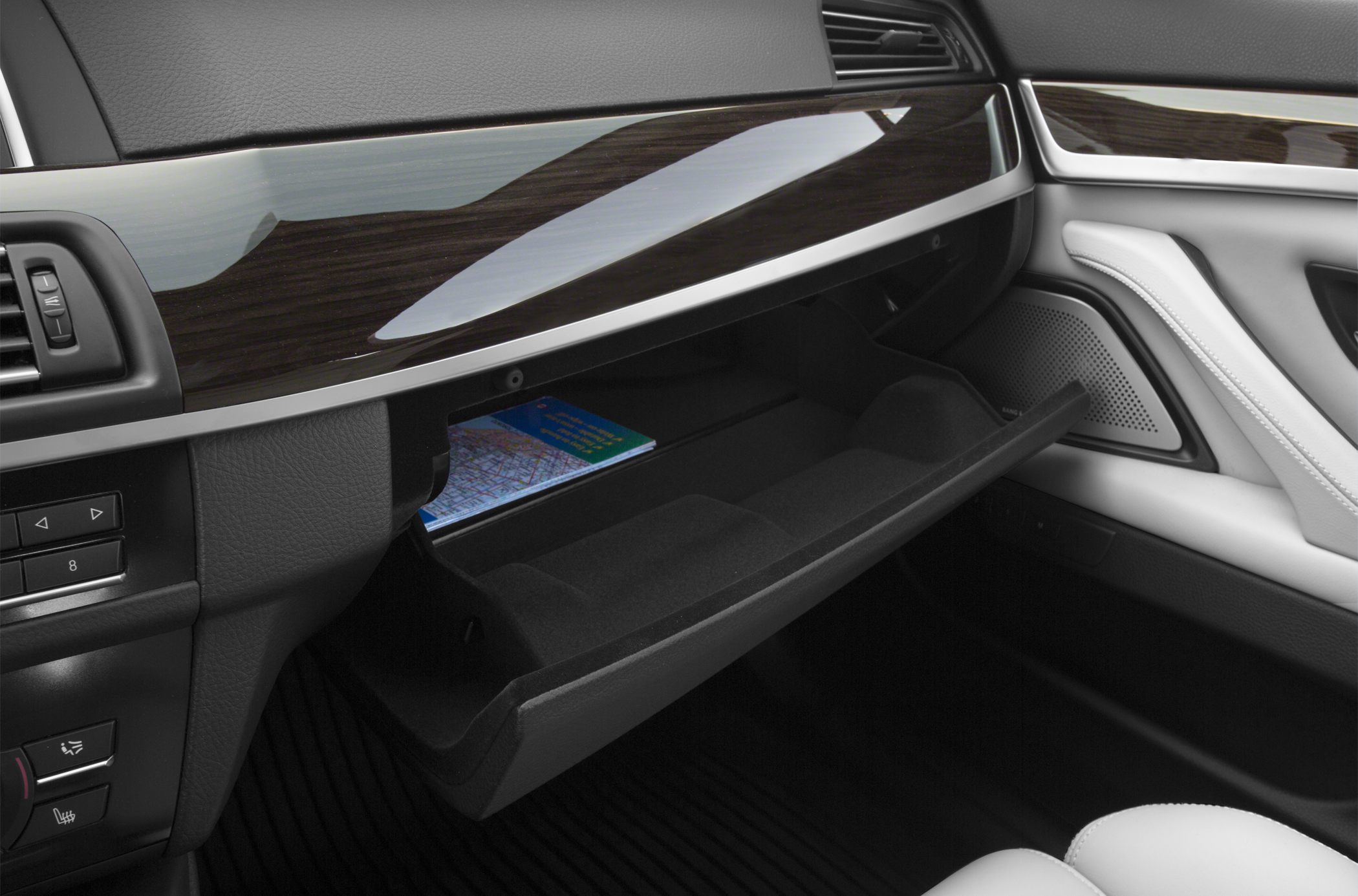 Open glove compartment with wood trim and premium materials