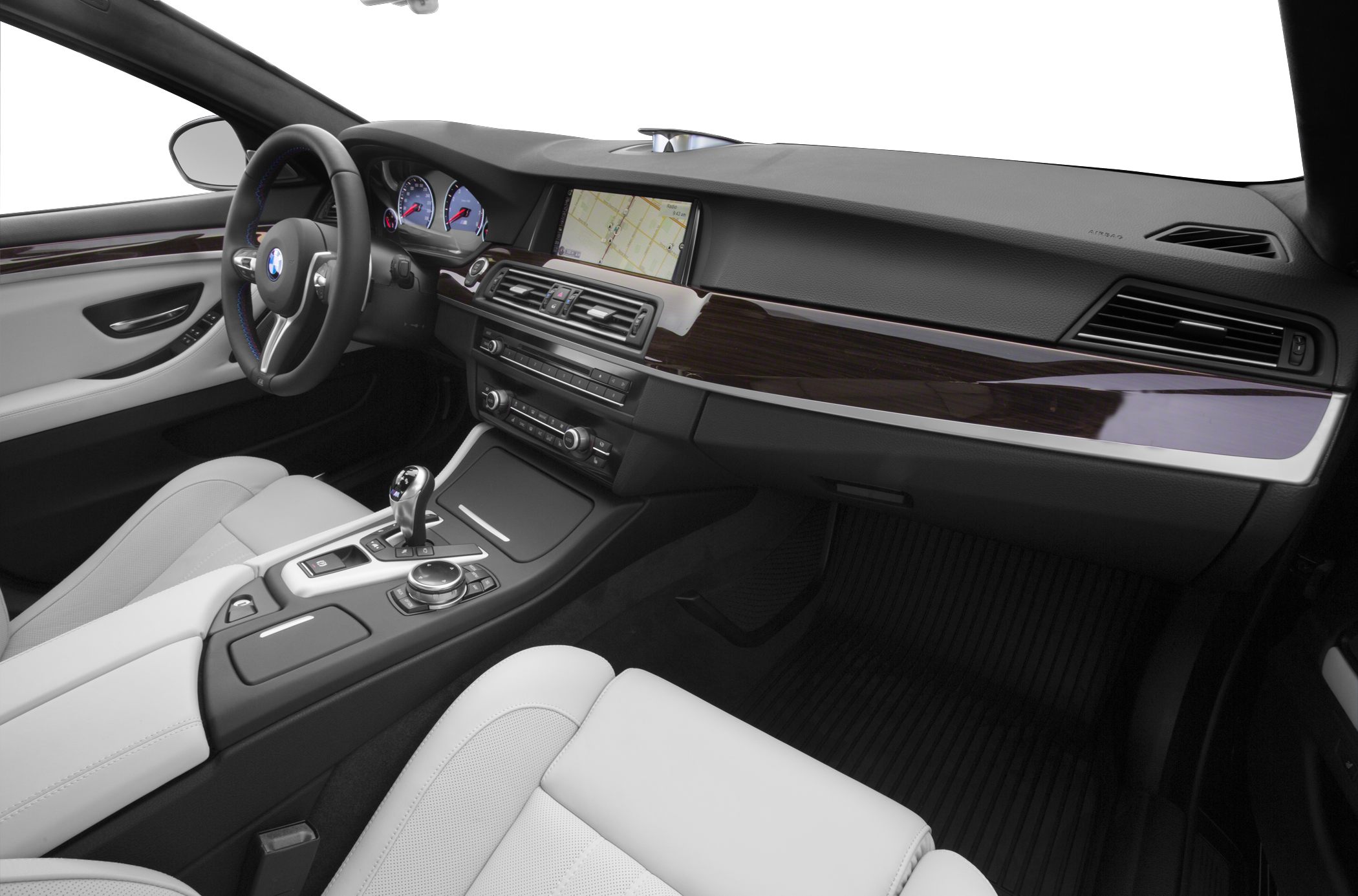 Luxury car interior with dashboard, steering wheel, and navigation screen