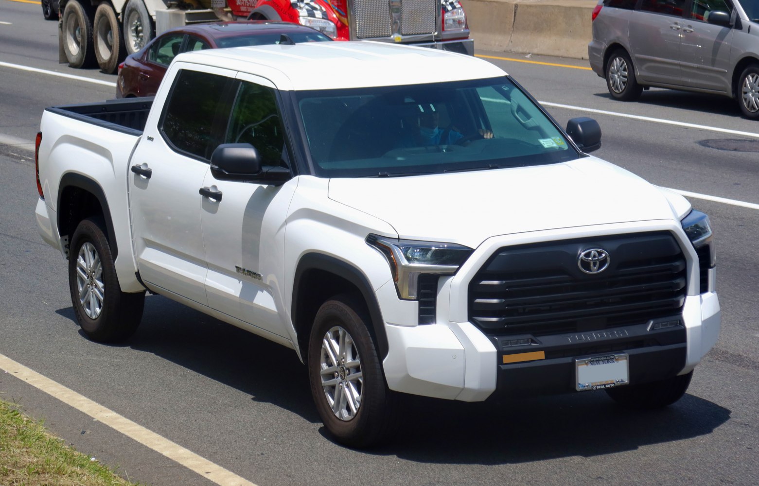 Bold front grille and four-door pickup design