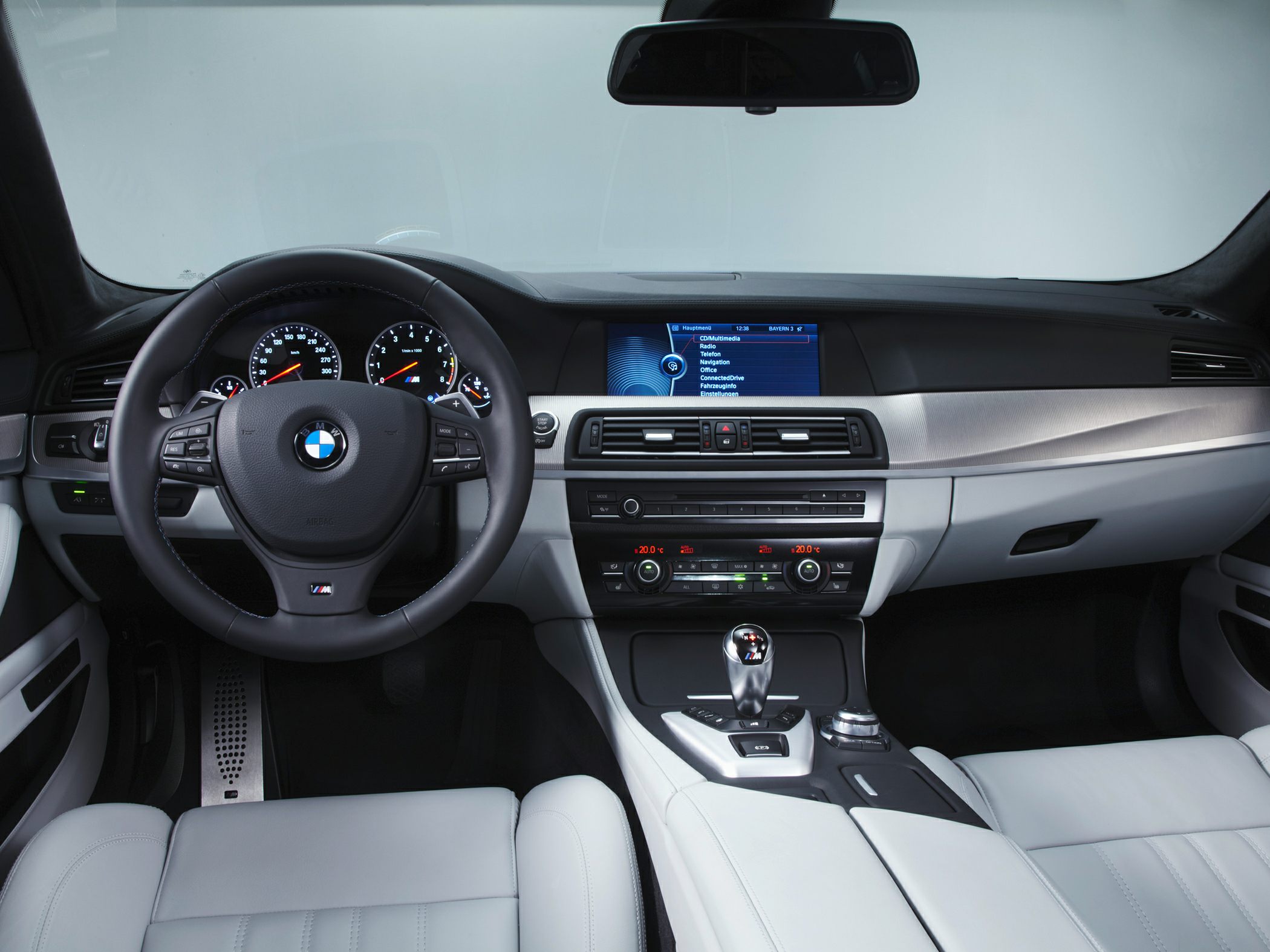 Steering wheel, dashboard, infotainment screen, gear shifter