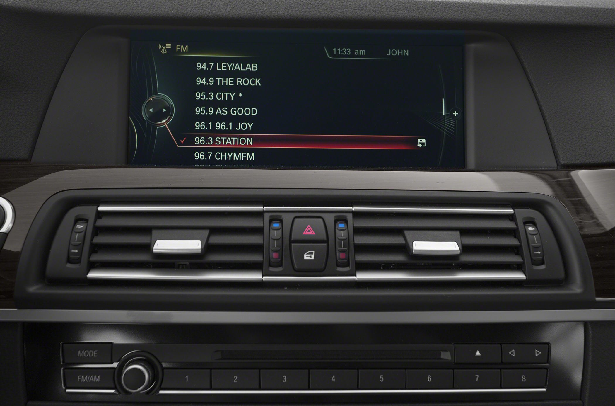 Infotainment screen and climate control vents on a car dashboard