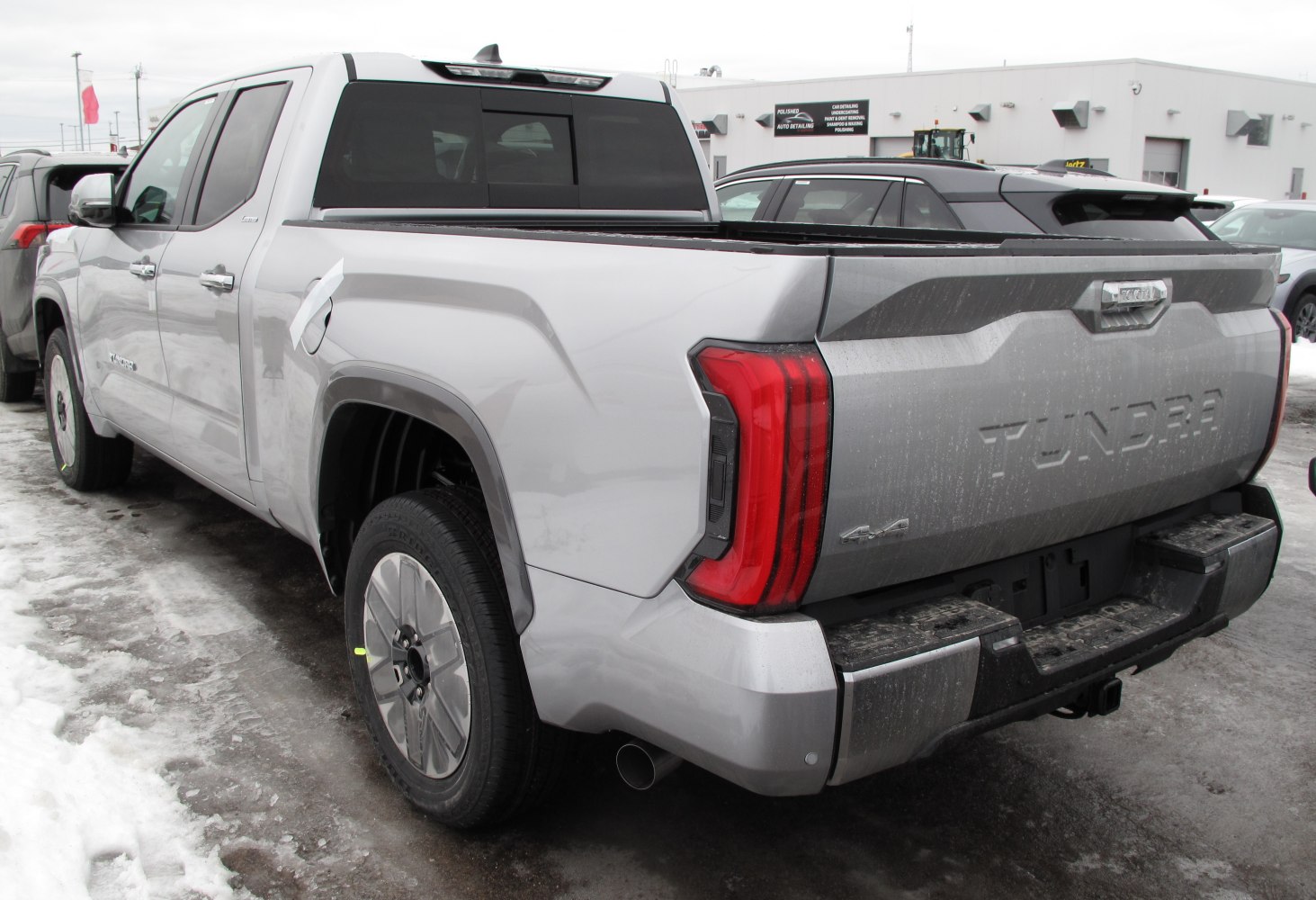 Rear side view with tail light and truck bed of a pickup