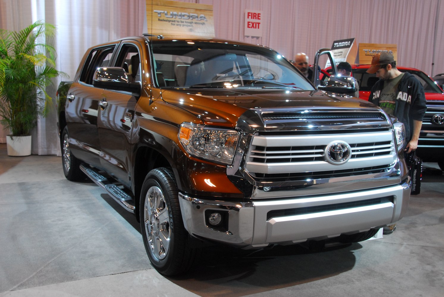 Large crew cab pickup with chrome grille and integrated fog lights