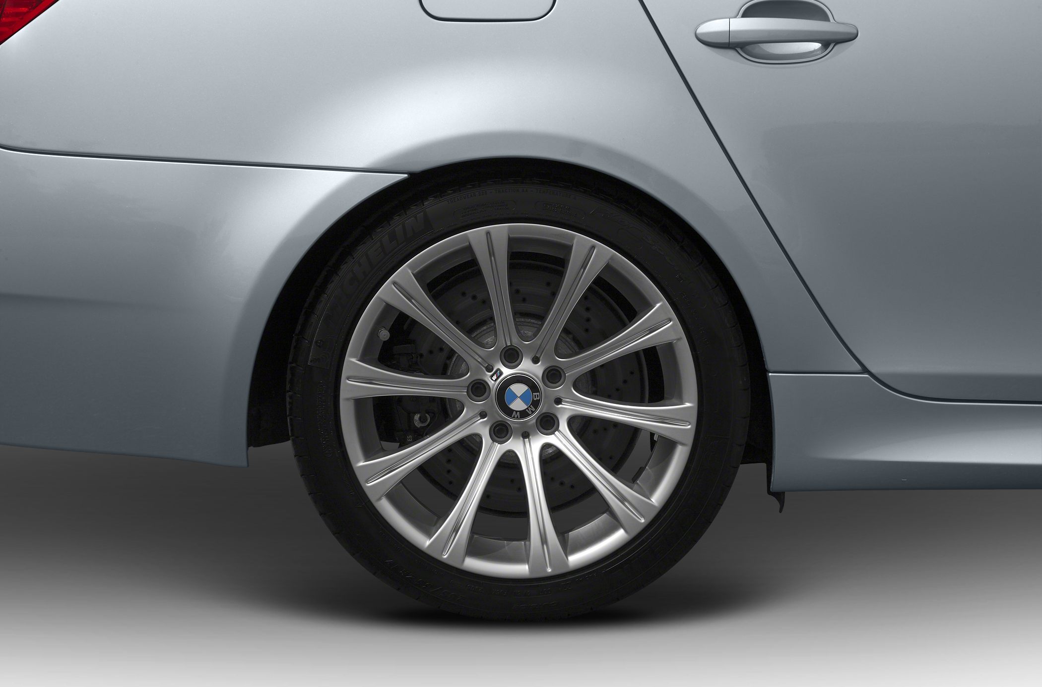 Rear alloy wheel and brake disc of a car.