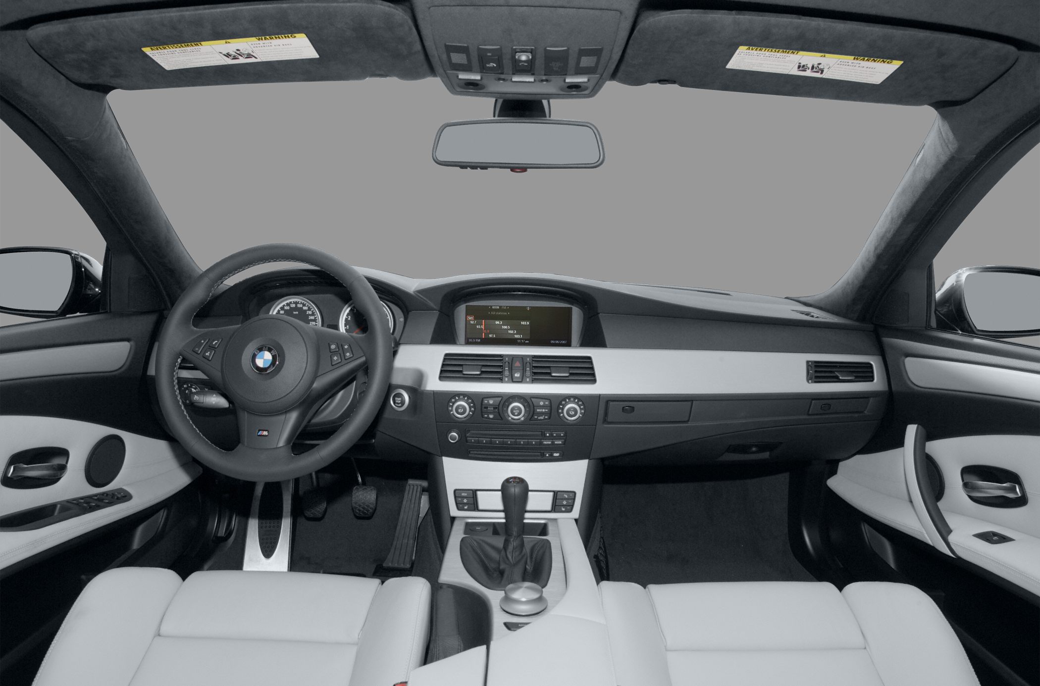 Interior view of dashboard and steering wheel with leather seats