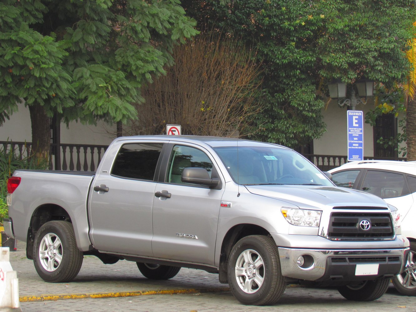 Silver pickup with CrewMax cabin and alloy wheels front-side view