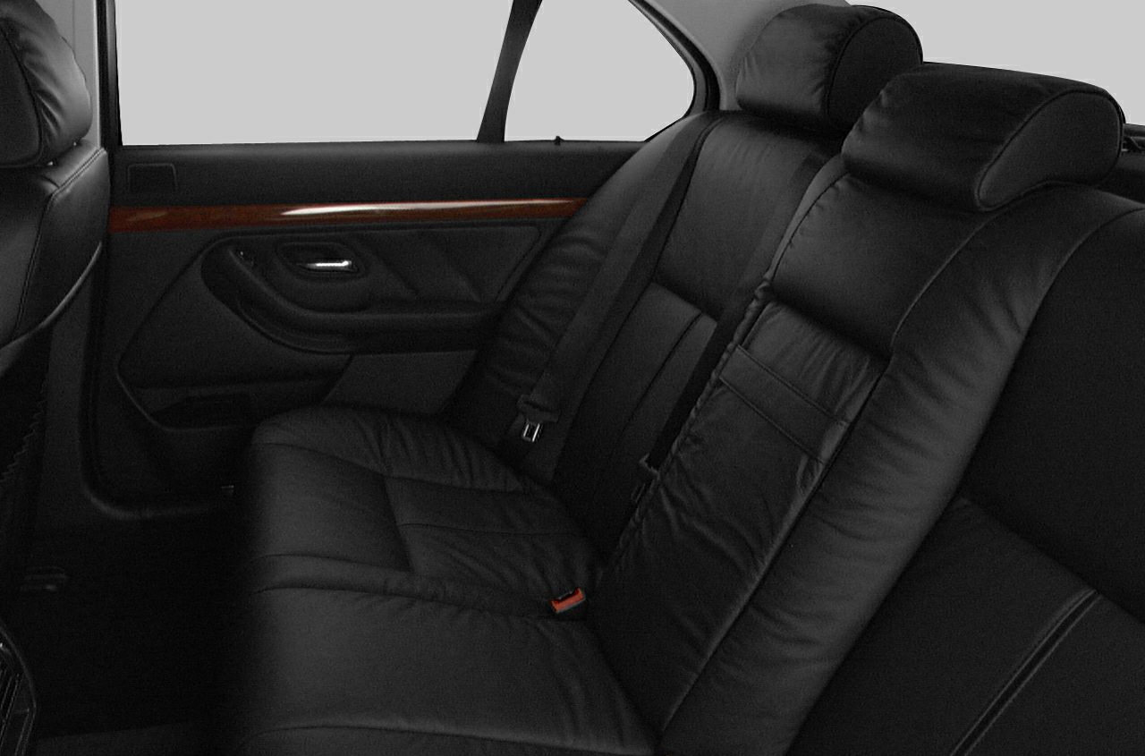 Black leather rear seats with wood trim and spacious interior
