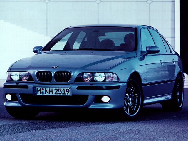 Front view with kidney grille, quad headlights, fog lamps, alloy wheels